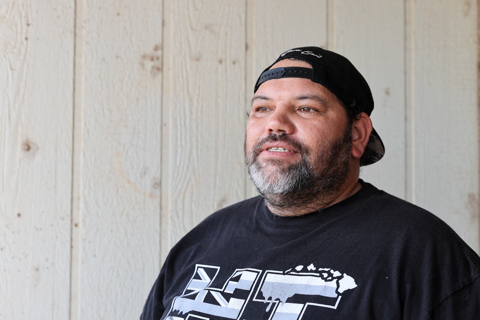 Joshua Kamalo, 43, speaks at his home about his election ordeal after his mail-in ballot was rejected by Maui County stating they couldn't verify his signature, Wednesday, Dec. 18, 2024, in Kahului, Hawaii. (AP Photo/Marco Garcia)