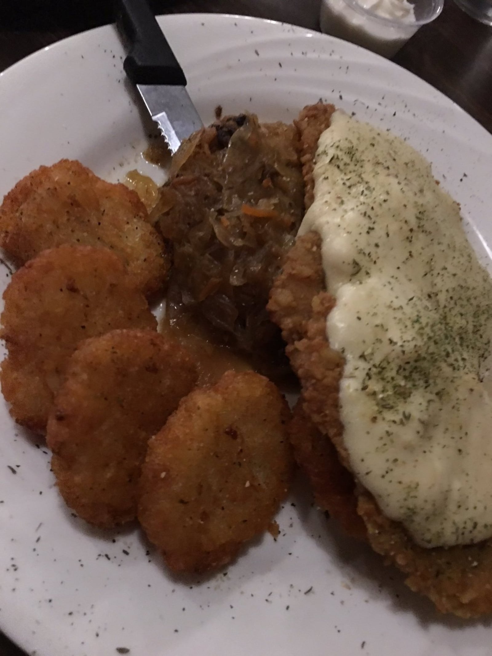 The Hunter Schnitzel ($16), a pretzel crusted pork loin, sauteed and topped with Dijon cream sauce served with potato pancakes and house sauerkraut. CONTRIBUTED PHOTO BY ALEXIS LARSEN