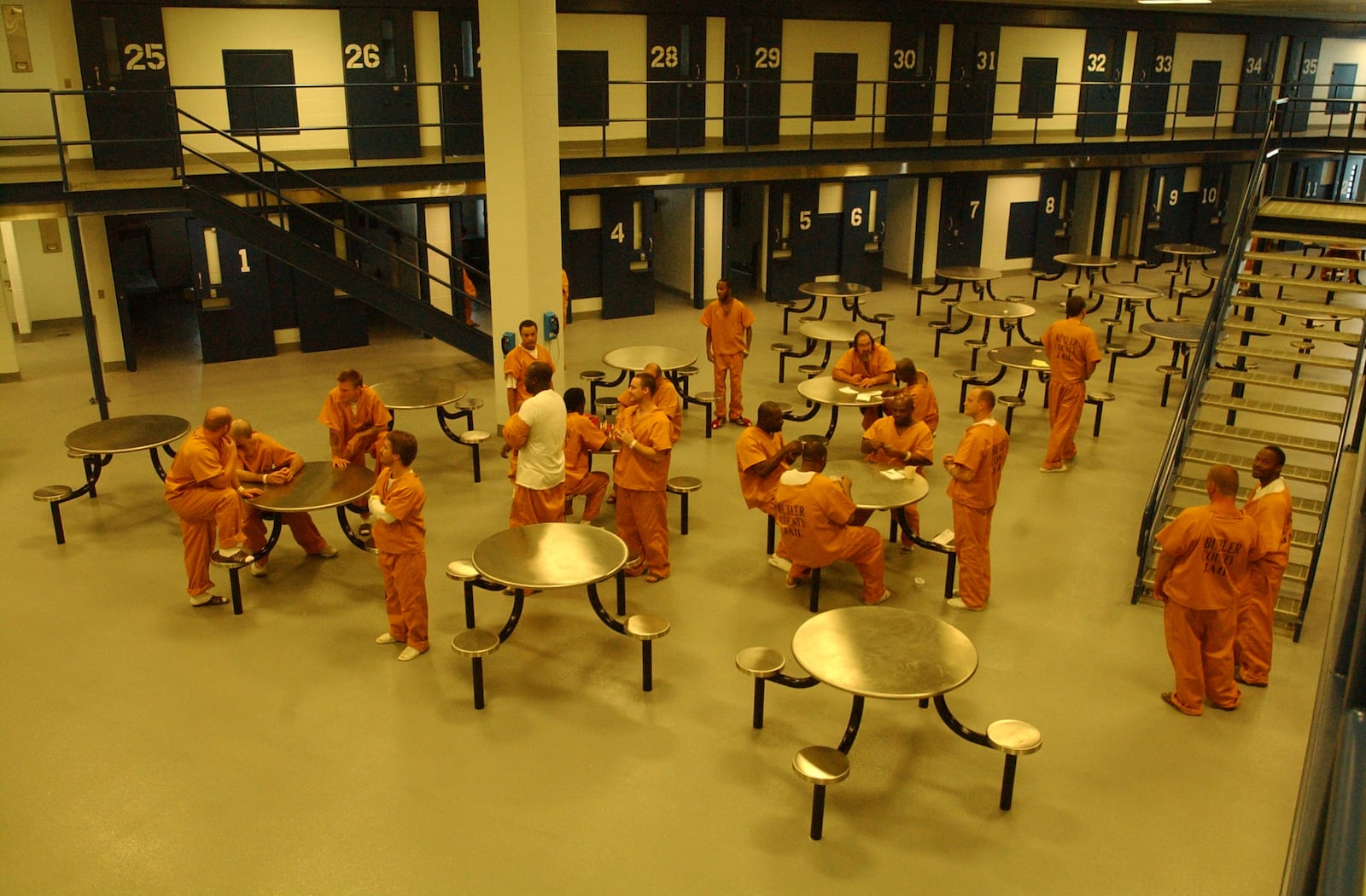 Inmates congregate in C Pod of the new Butler County Jail.  Their cells line two sides of the triangular-shaped pod.
JOHN JANCO/JOURNALNEWS