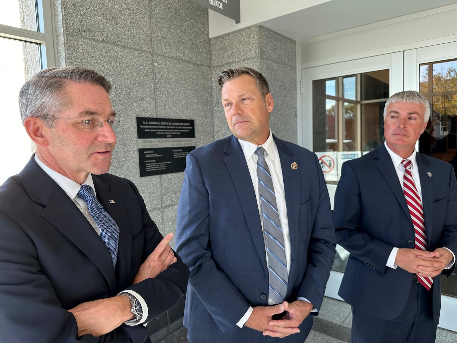 From left, Republican Attorneys General Drew Wrigley of North Dakota, Kris Kobach of Kansas and Marty Jackley of South Dakota speak to reporters after a hearing in federal court in Bismarck, N.D., on Tuesday, Oct. 15, 2024. (AP Photo/Jack Dura)