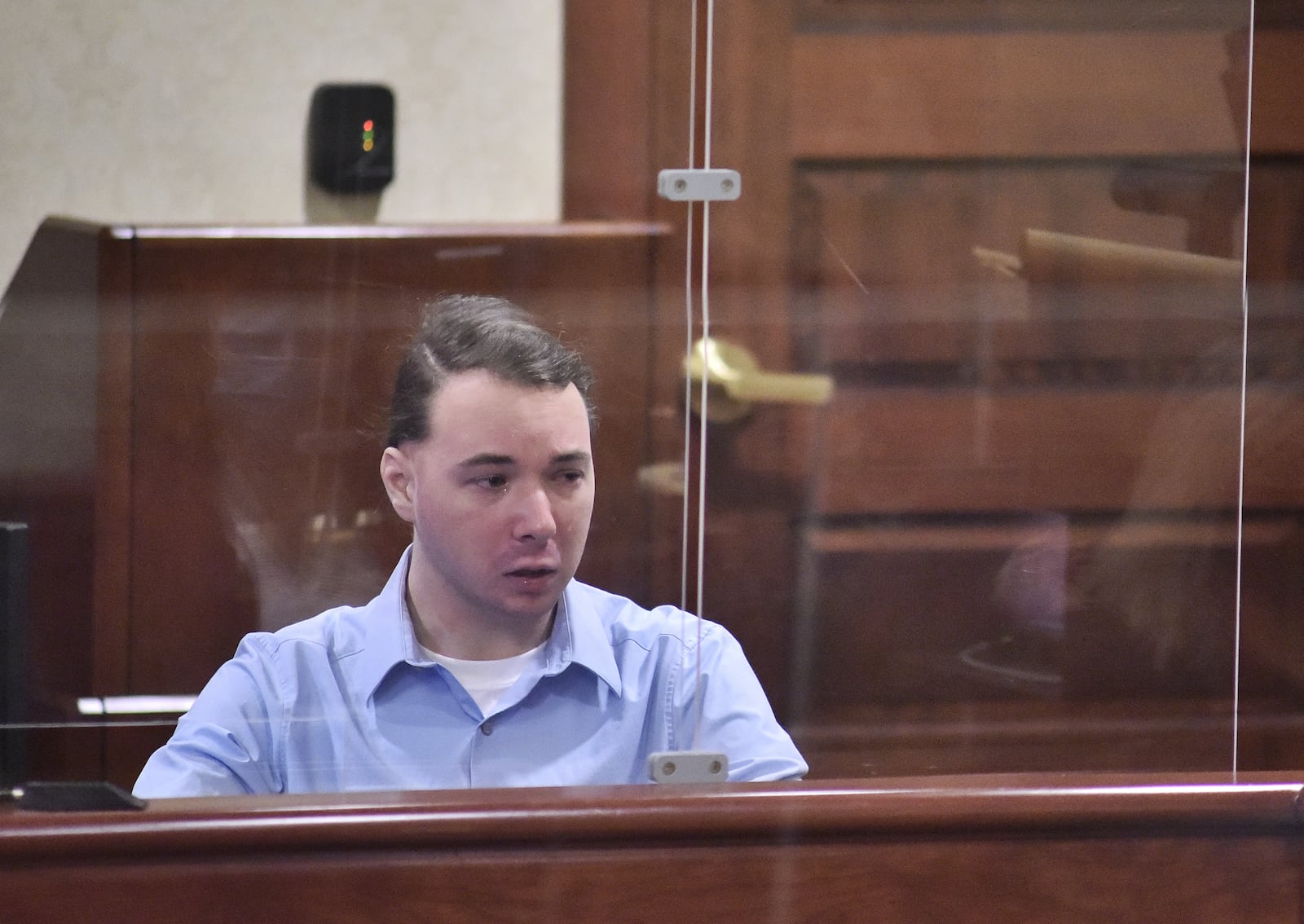 Peyton McFarland takes the stand during his trial for the death of Chris Hacker Friday, April 23, 2021 in Butler County Common Pleas Court in Hamilton. NICK GRAHAM / STAFF