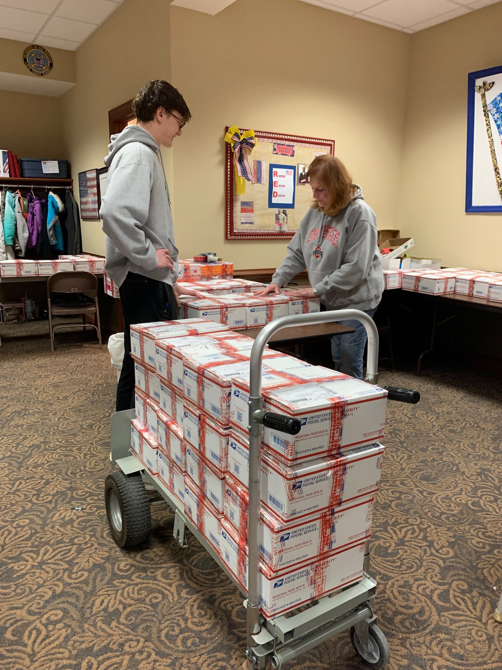 Volunteers are always needed to pack boxes for the troops.