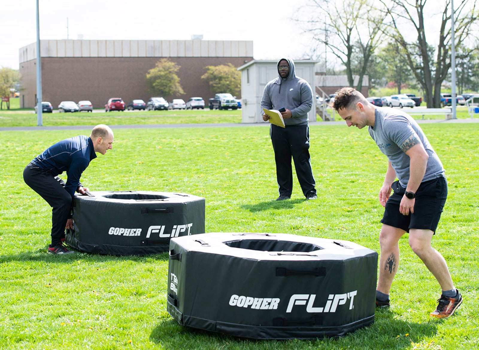 Competitors flip tires over as fast as possible during a timed event April 15 at the All-Star Fitness Challenge on Wright-Patterson Air Force Base. U.S. AIR FORCE PHOTO/WESLEY FARNSWORTH