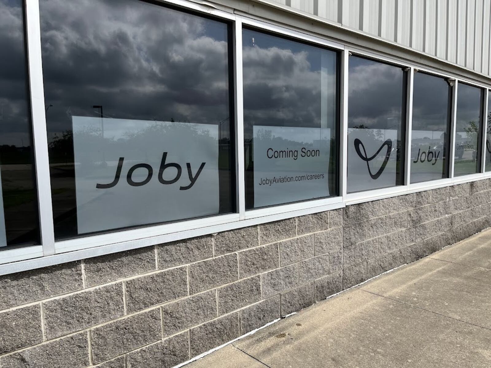 In a photo taken in August 2024, Joby Aviation placards could be seen in the windows of the former U.S. Postal Service facility on Concorde Drive near the Dayton International Airport. THOMAS GNAU/STAFF