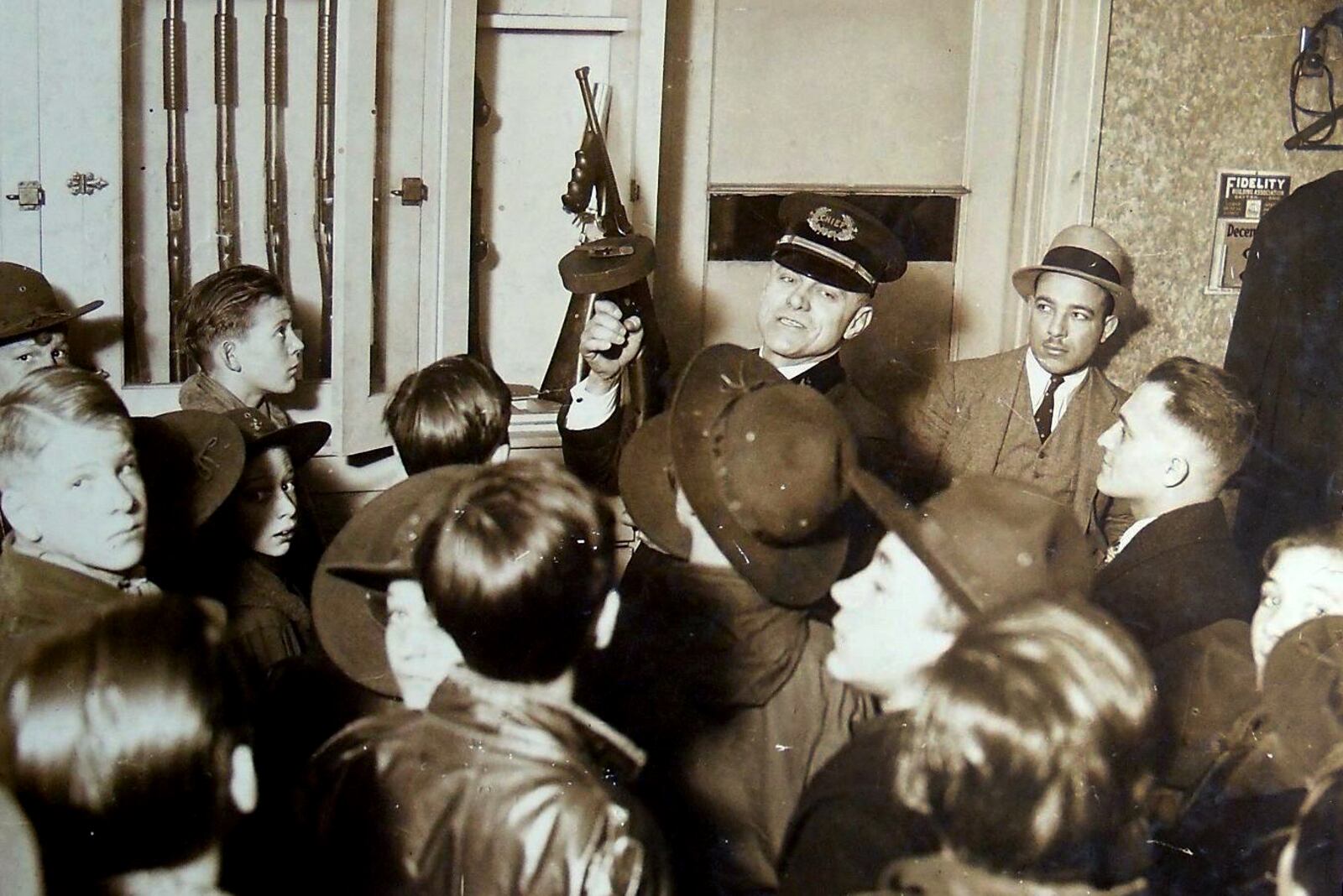 Chief Rudy Wurstner demonstrates the mechanics of a Colt Thompson submachine gun to a Dayton area Boy Scout troops in 1930. CONTRIBUTED PHOTO / DAYTON POLICE HISTORY FOUNDATION