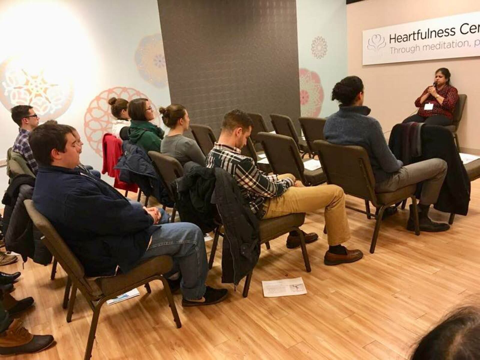 Uma Mullapudi guides a group into meditative state at the Heartfulness Lounge at the Fairfield Mall.