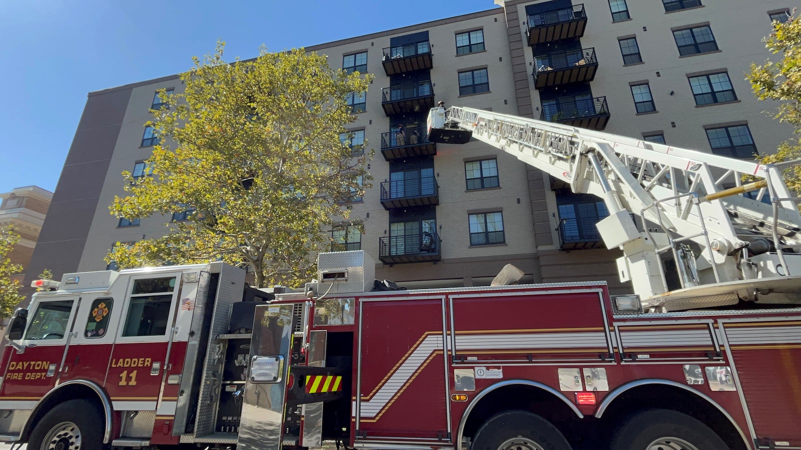 A fire broke out at the Monument apartments across from RiverScape in downtown Dayton at about 12:50 p.m. on Oct. 10, 2023. CORNELIUS FROLIK / STAFF