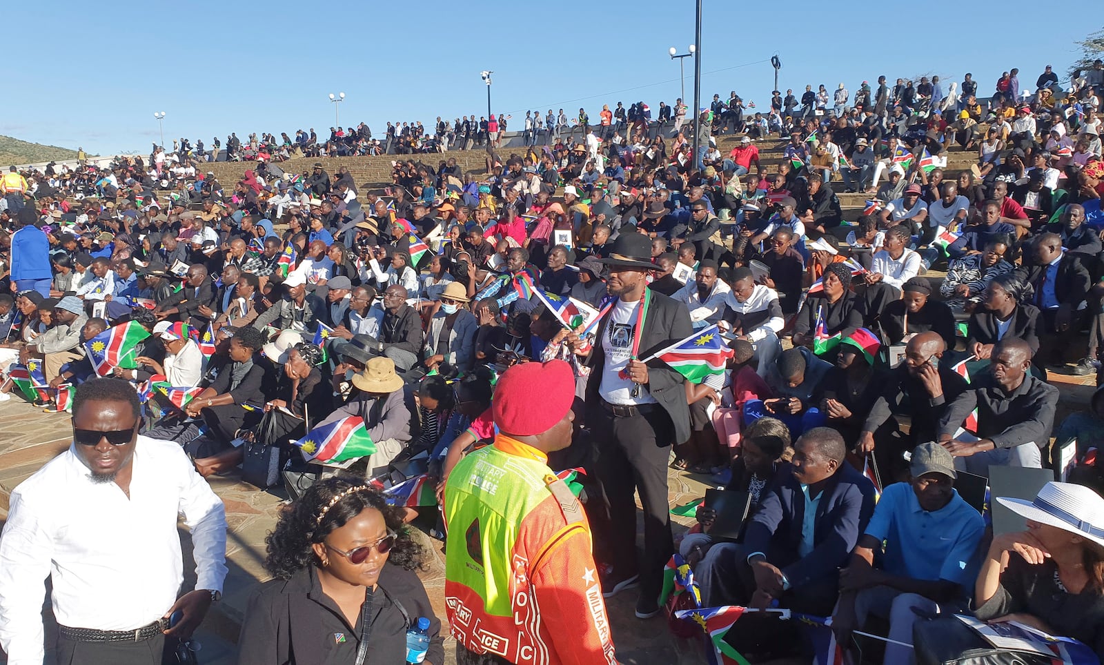 People gather for the state funeral for Namibia's founding president Sam Nujoma at Heroes' Acre, in Windhoek, Namibia, Saturday, March 1, 2025. (AP Photo/Dirk Heinrich)