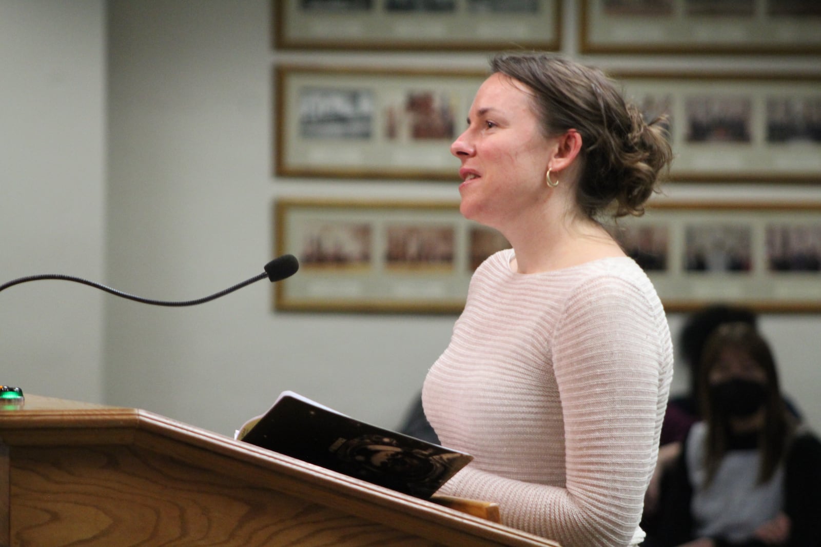 Erin McKenzie, a Dayton resident, speaks at Wednesday's city commission meeting against a proposed commission rule change. CORNELIUS FROLIK / STAFF