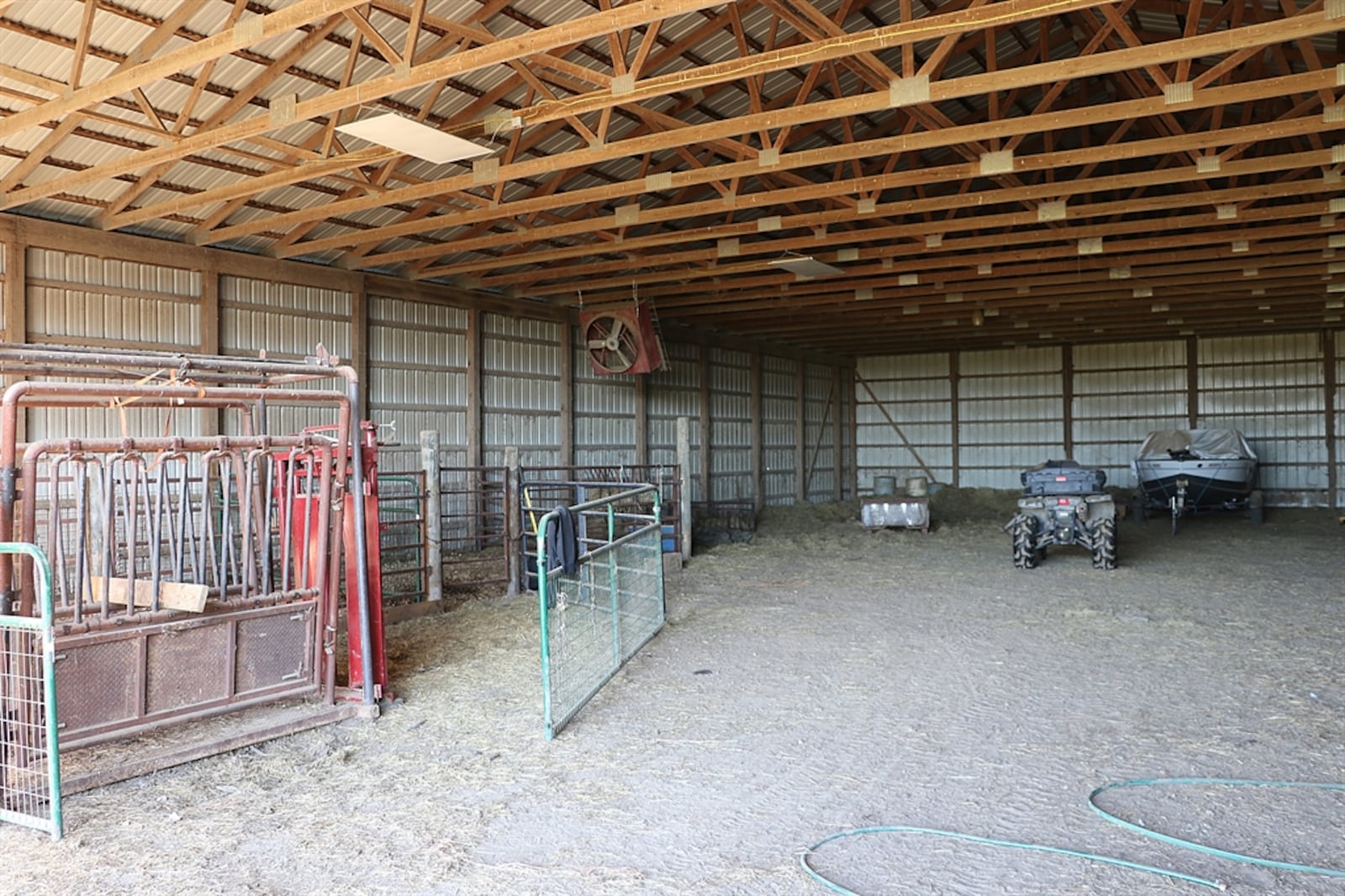 Listed for $558,950 by Berkshire Hathaway Home Services Professional Realty, the 10-acre property at 3095 E. Peterson Road in Lost Creek Twp. includes the fenced pasture, stocked pond, two pole barns, an above-ground swimming pool and a two-story house with an attached two-car garage. A gravel drive leads up from the roadway to the concrete parking near the garage as the house sits well off the road. The stalled barn with dirt floor has fencing for small livestock. CONTRIBUTED