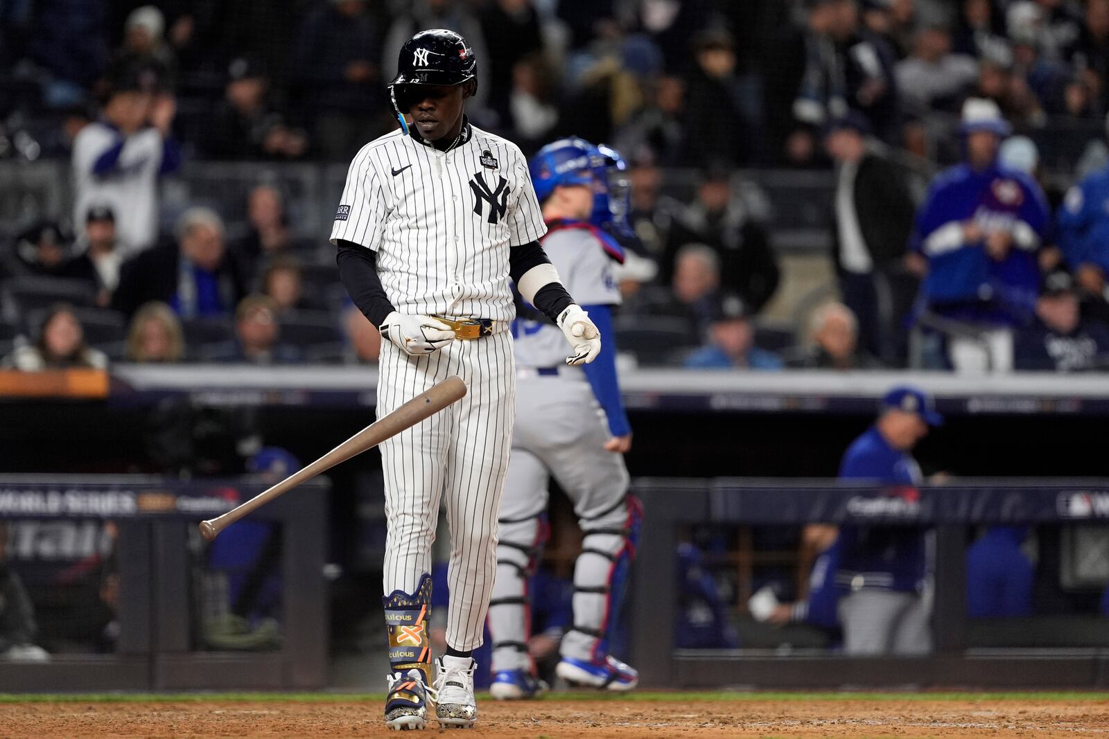 New York Yankees' Jazz Chisholm Jr. throws his bat after striking out to end the eighth inning in Game 3 of the baseball World Series against the Los Angeles Dodgers, Monday, Oct. 28, 2024, in New York. (AP Photo/Godofredo A. Vásquez)