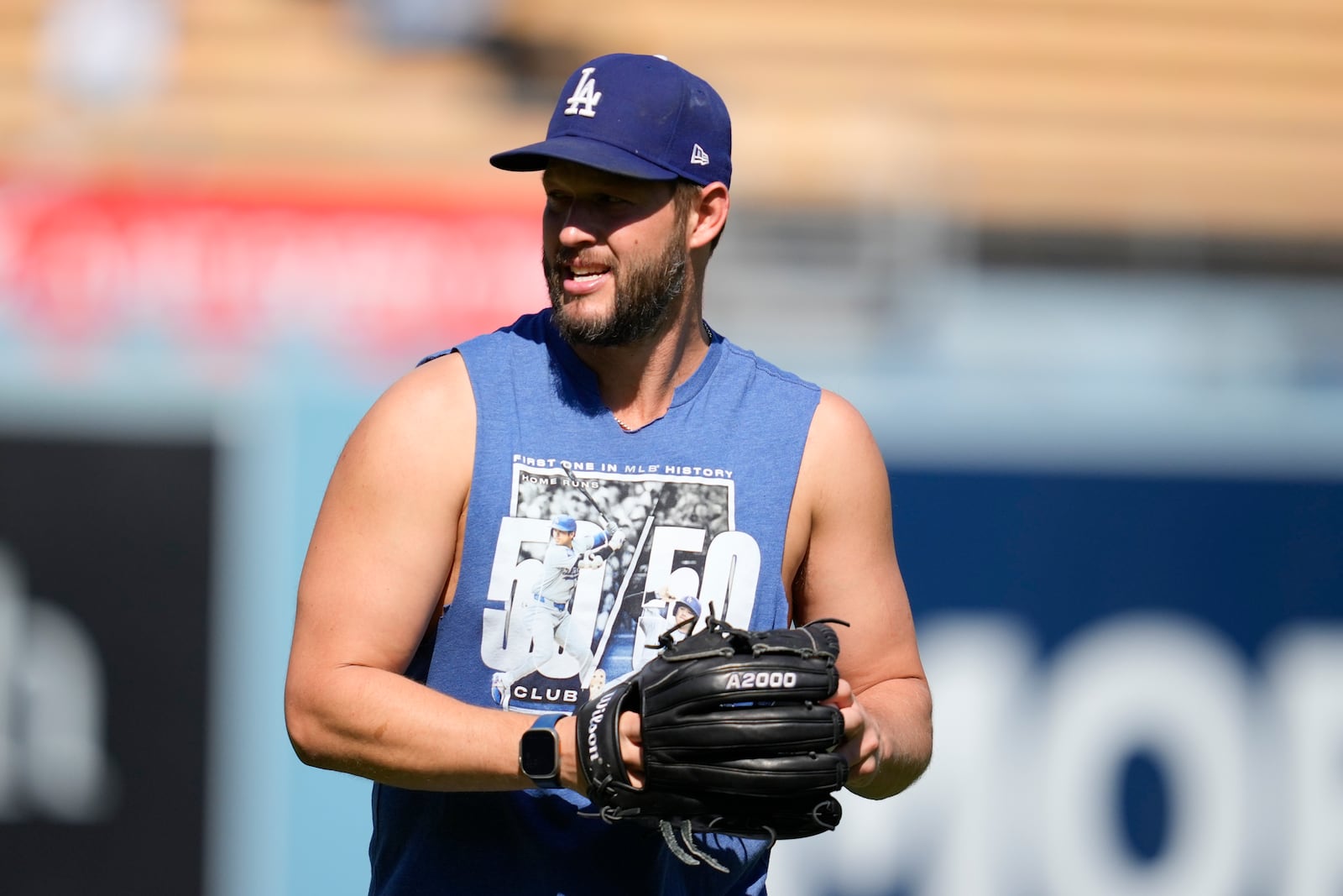 Los Angeles Dodgers pitcher Clayton Kershaw warms up before Game 2 of a baseball NL Division Series against the San Diego Padres, Sunday, Oct. 6, 2024, in Los Angeles. (AP Photo/Ashley Landis)