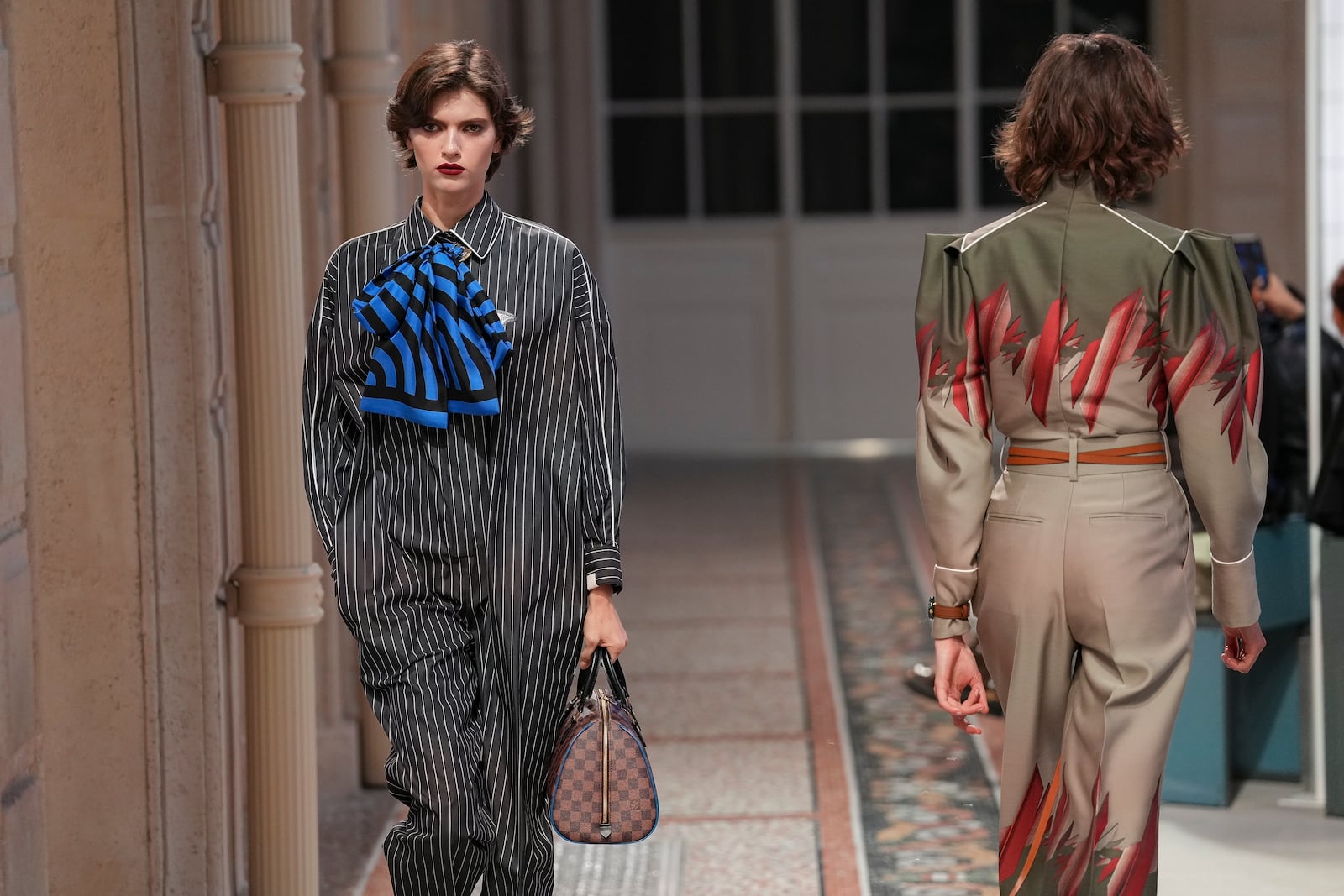 Models wear creations as part of the Louis Vuitton Fall/Winter 2025-2026 Womenswear collection presented in Paris, Monday, March 10, 2025. (Photo by Scott A Garfitt/Invision/AP)