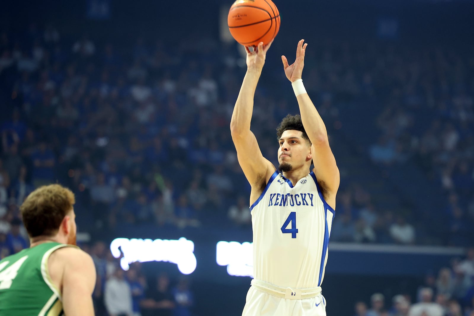 Kentucky's Koby Brea (4) shoots over Wright State's Brandon Noel, left, during the first half of an NCAA college basketball game in Lexington, Ky., Monday, Nov. 4, 2024. (AP Photo/James Crisp)