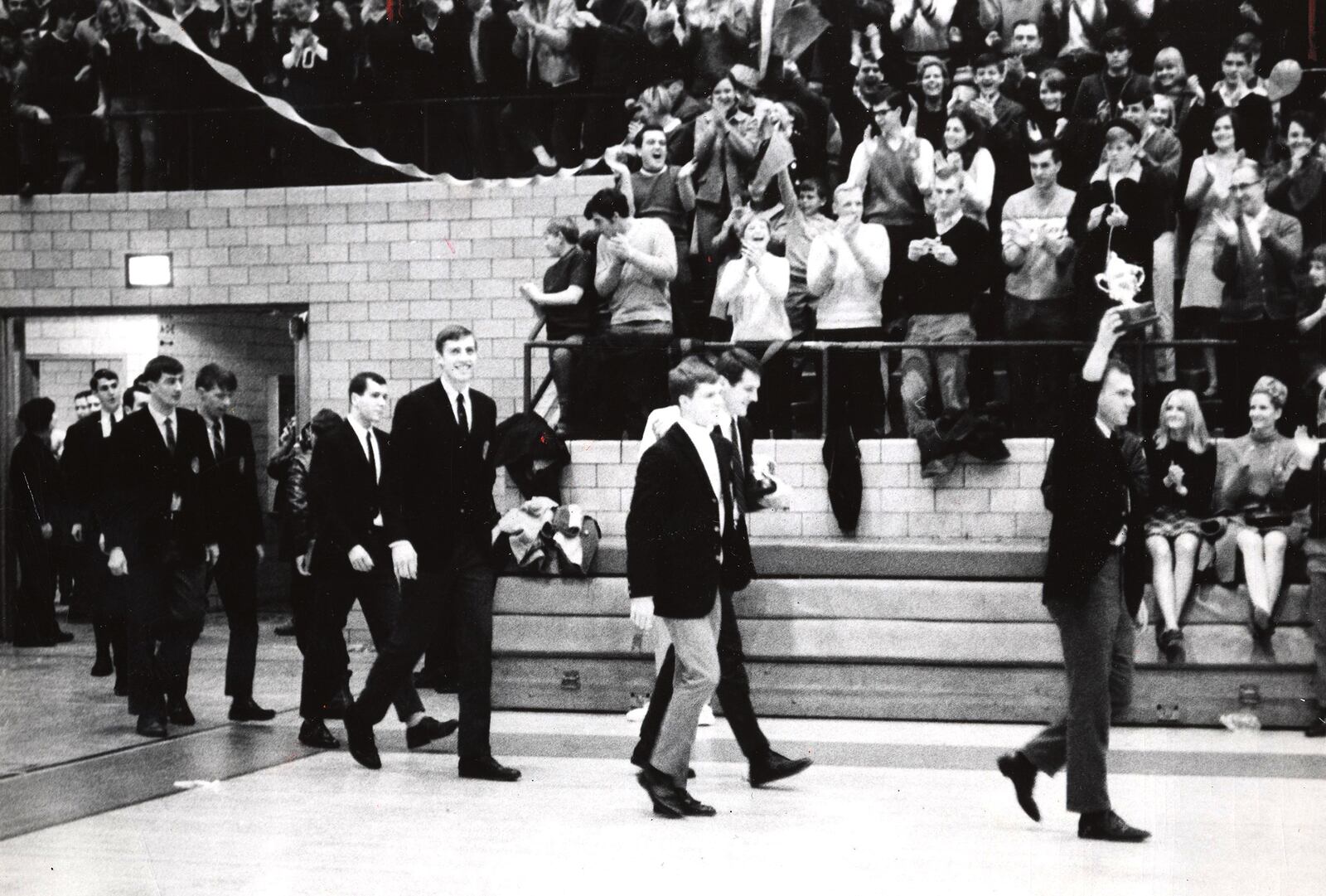 The University of Dayton Flyers return to a celebration in the Fieldhouse after winning the 1968 NIT over Kansas. DAYTON DAILY NEWS ARCHIVE