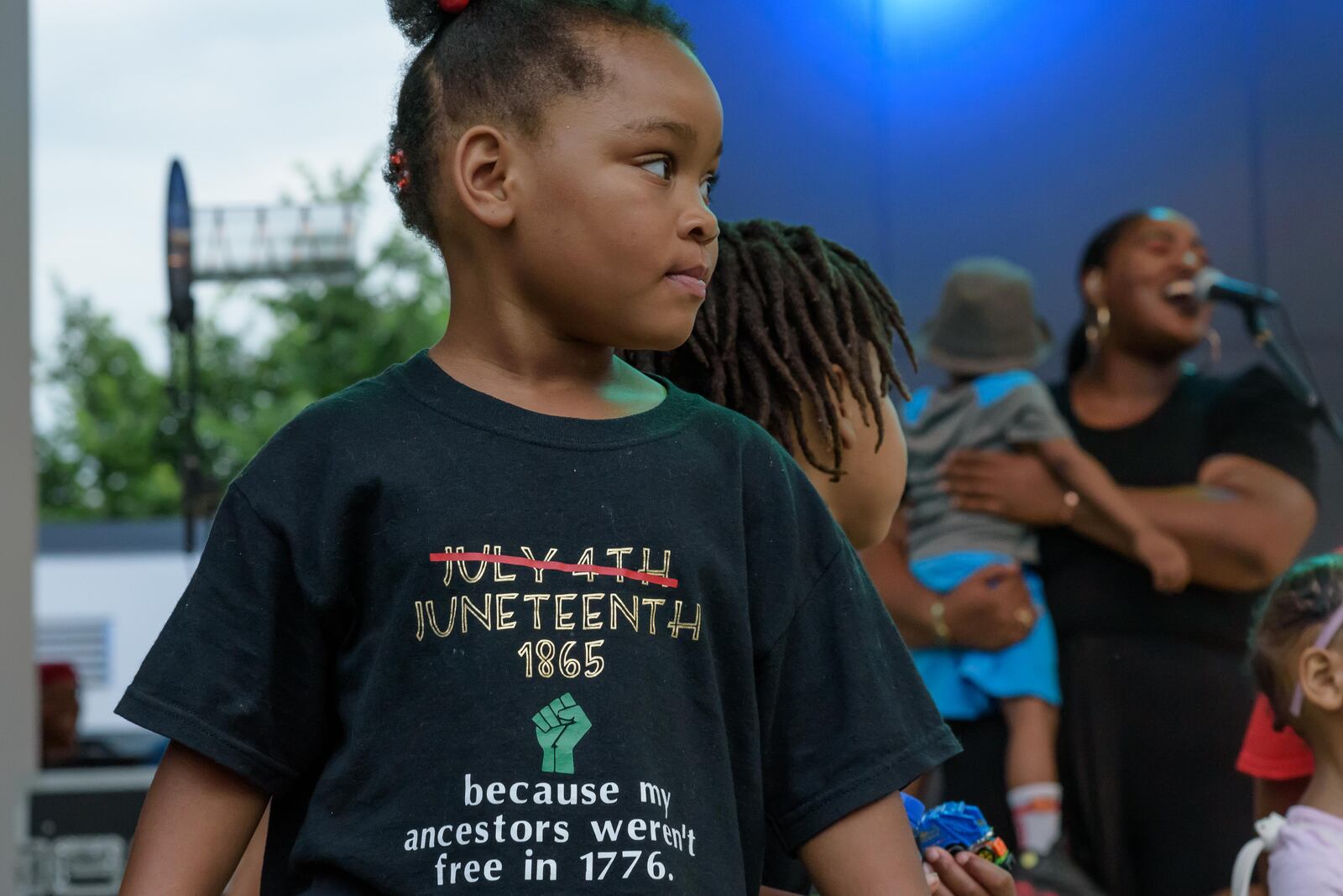 A young patron enjoys the Juneteenth Commemoration, Celebration and Community Concert at Levitt Pavilion in downtown Dayton on Saturday, June 19, 2021. TOM GILLIAM / CONTRIBUTING PHOTOGRAPHER