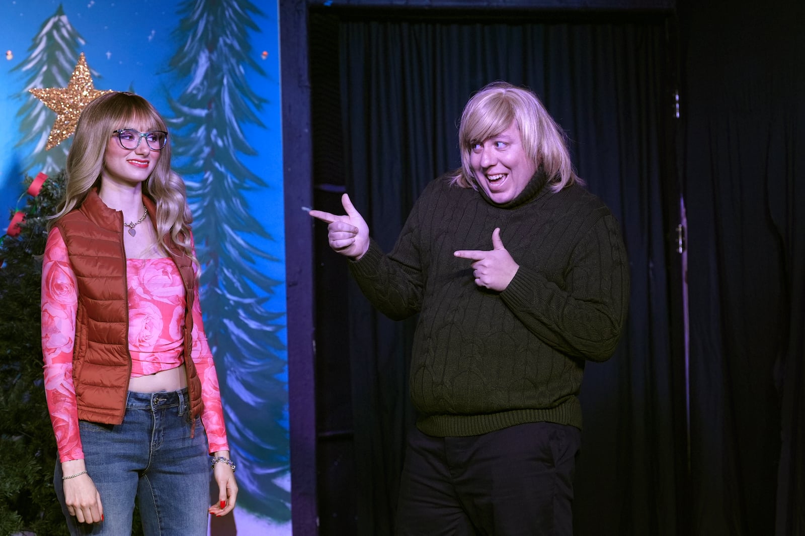 Mickey Howell, right, and GinaKay Howell appear during a dress rehearsal for the production of "The Holiday Channel Christmas Movie Wonderthon" at the Ghostlight Theatre in Sun City West, Ariz., on Dec. 9, 2024. (AP Photo/Ross D. Franklin)