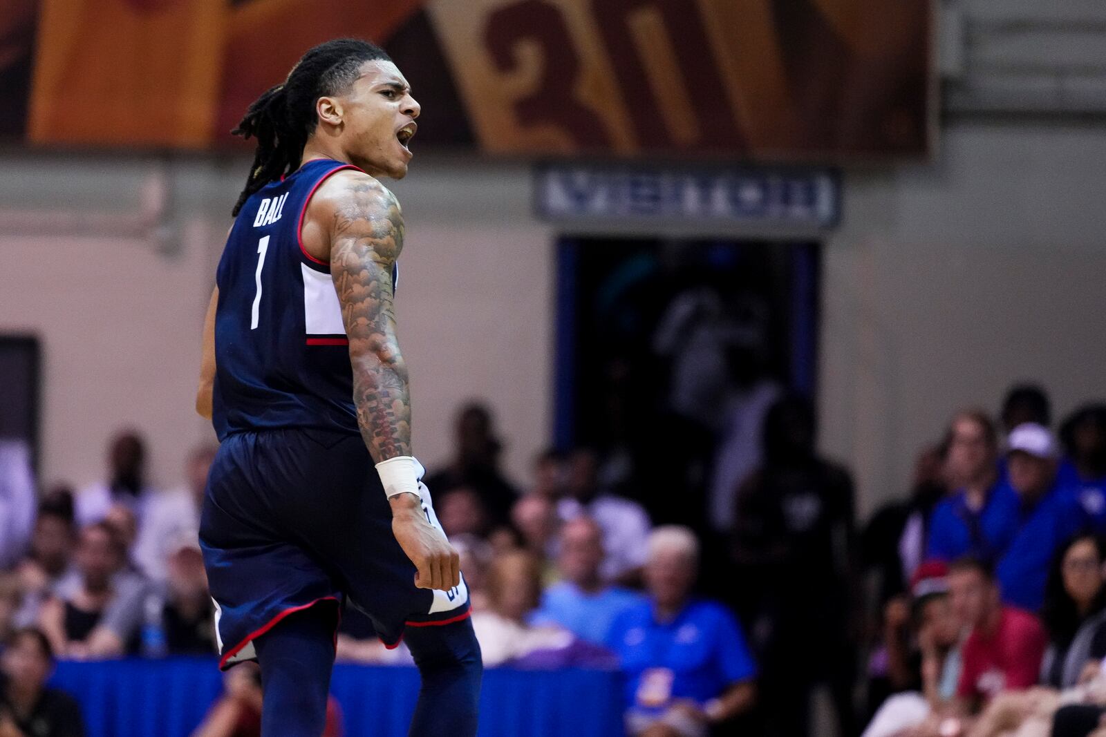 UConn guard Solo Ball reacts after a basket against Colorado during the second half of an NCAA college basketball game at the Maui Invitational Tuesday, Nov. 26, 2024, in Lahaina, Hawaii. Colorado won 73-72. (AP Photo/Lindsey Wasson)