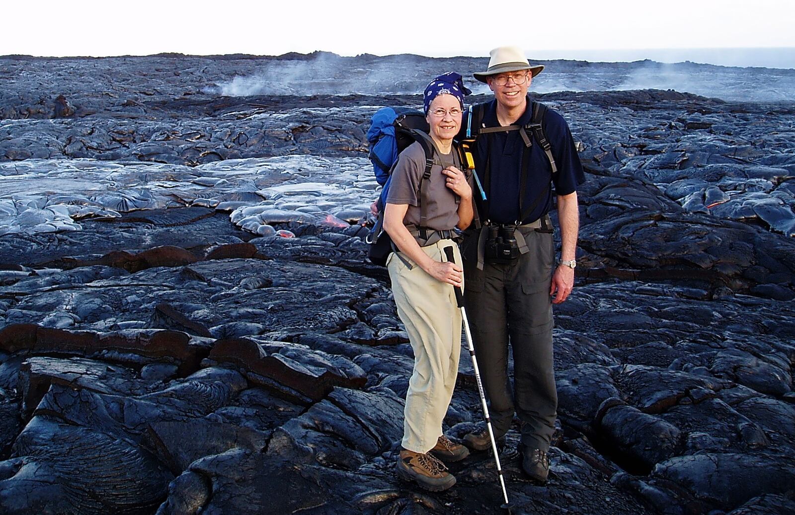 Peggy and Rich Bowman in front of a lava flow from a Kilahuea eruption in the Hawaiian Islands in 2007. The hike in from accessible roads was four miles over rough lava terrain. CONTRIBUTED