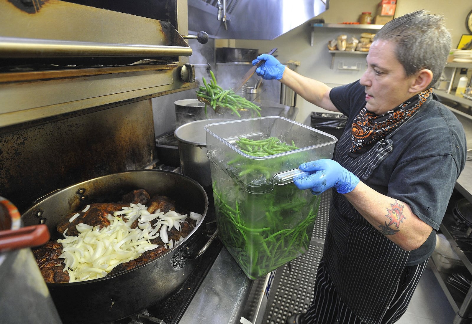 Elizabeth Liz Valenti, the head chef, at Wheat Penny Oven & Bar, on Wayne Ave. works nearly 15 hours a day preparing food for takeout orders through the day. The restaurant will be participating in Winter Restaurant Week. MARSHALL GORBYSTAFF