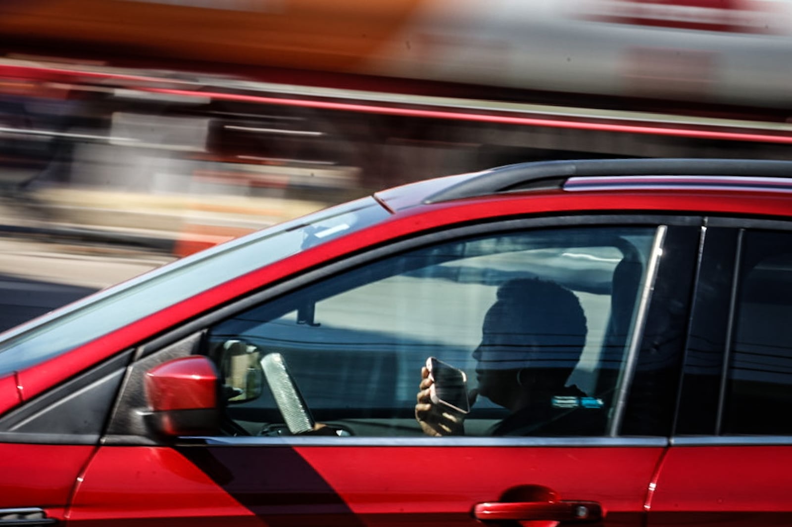 A driver on Brown Street near East Stewart Street talks on their cellphone Tuesday October 3, 2023. The distracted driving warning period ends today Oct. 4, 2023. Area police will be looking for distracted drivers on Thursday and will start ticketing drivers that do not comply. JIM NOELKER/STAFF