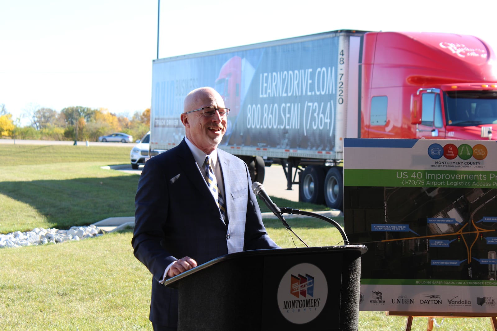 Steve Stanley, then-executive director of the Montgomery County Transportation Improvement District, at the groundbreaking for expanding U.S. 40 near the Dayton International Airport last year. Stanley retired as executive director and is now a development specialist at the TID.