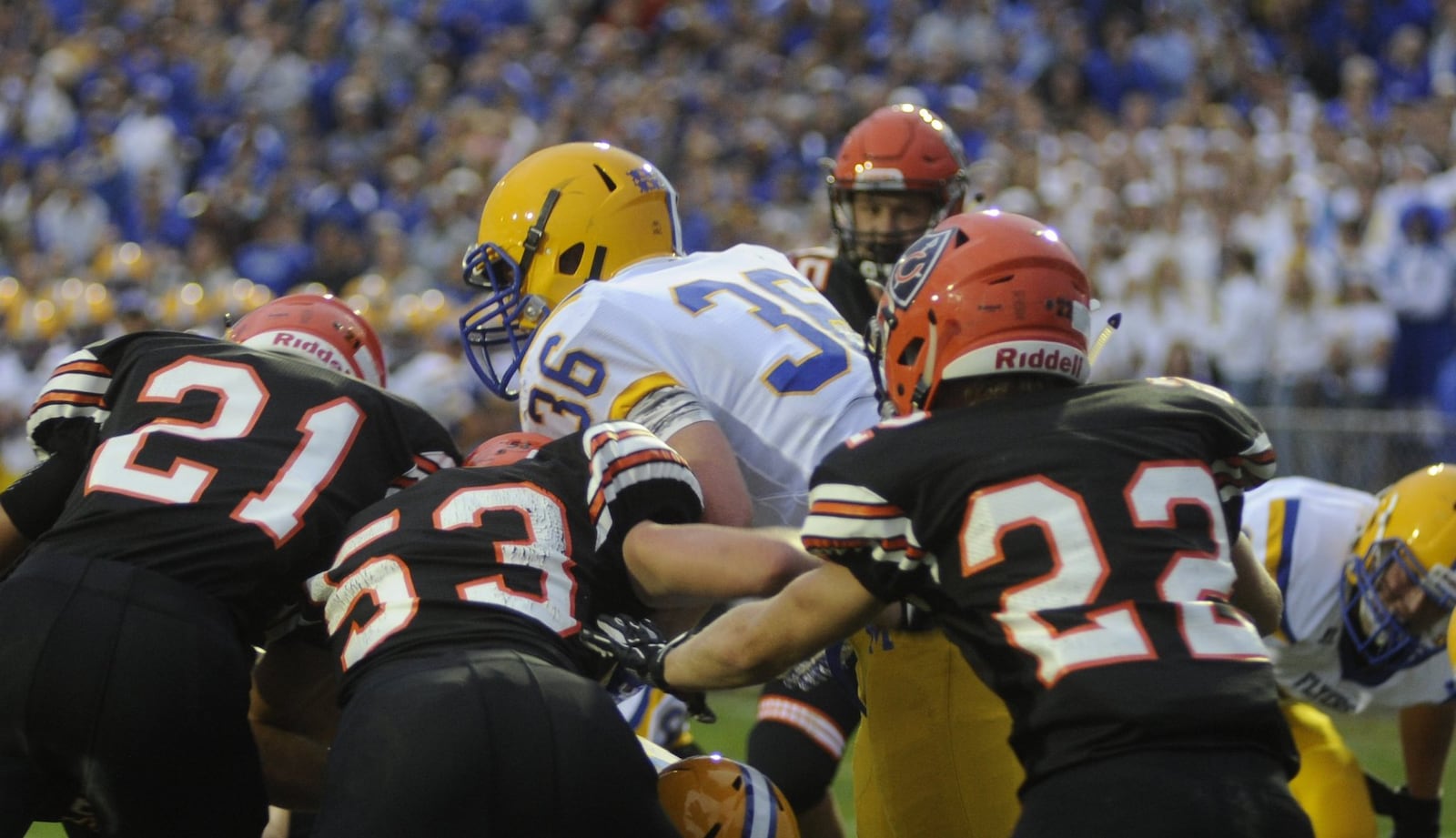 Marion Local running back Alex Partington is met by Coldwater defenders Justin Schwieterman (21), Derek Albers (53) and Ben Wenning (22). Marion Local defeated Coldwater 13-7 in a Week 3 game on Friday, Sept. 8, 2017. MARC PENDLETON / STAFF