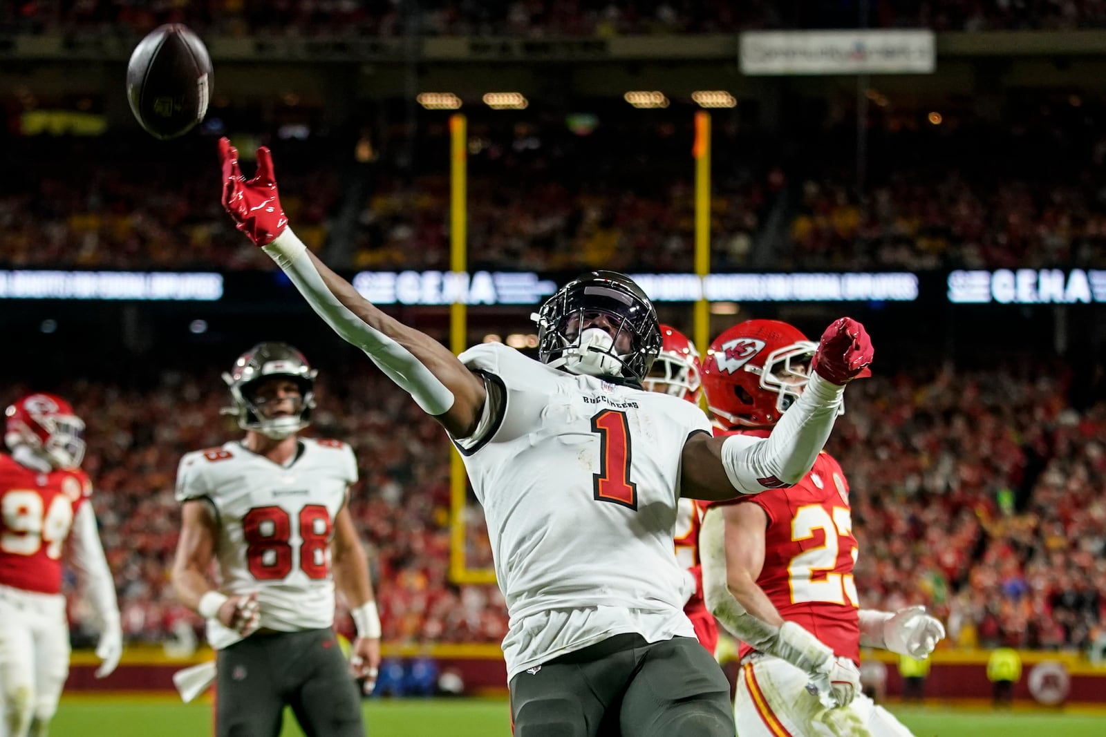 Tampa Bay Buccaneers running back Rachaad White (1) celebrates his touchdown against the Kansas City Chiefs during the first half of an NFL football game, Monday, Nov. 4, 2024, in Kansas City, Mo. (AP Photo/Ed Zurga)