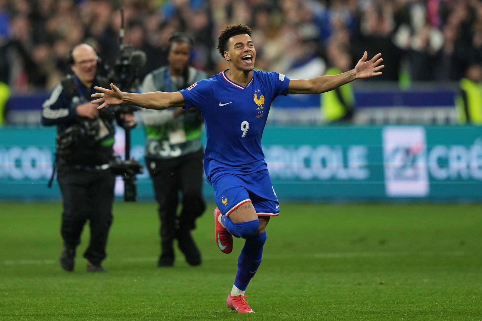 France's Desire Doue celebrates after winning the penalty shootout during the UEFA Nations League quarterfinal second leg soccer match between France and Croatia, at the Stade de France in Saint-Denis, outside Paris, Sunday, March 23, 2025. (AP Photo/Thibault Camus)