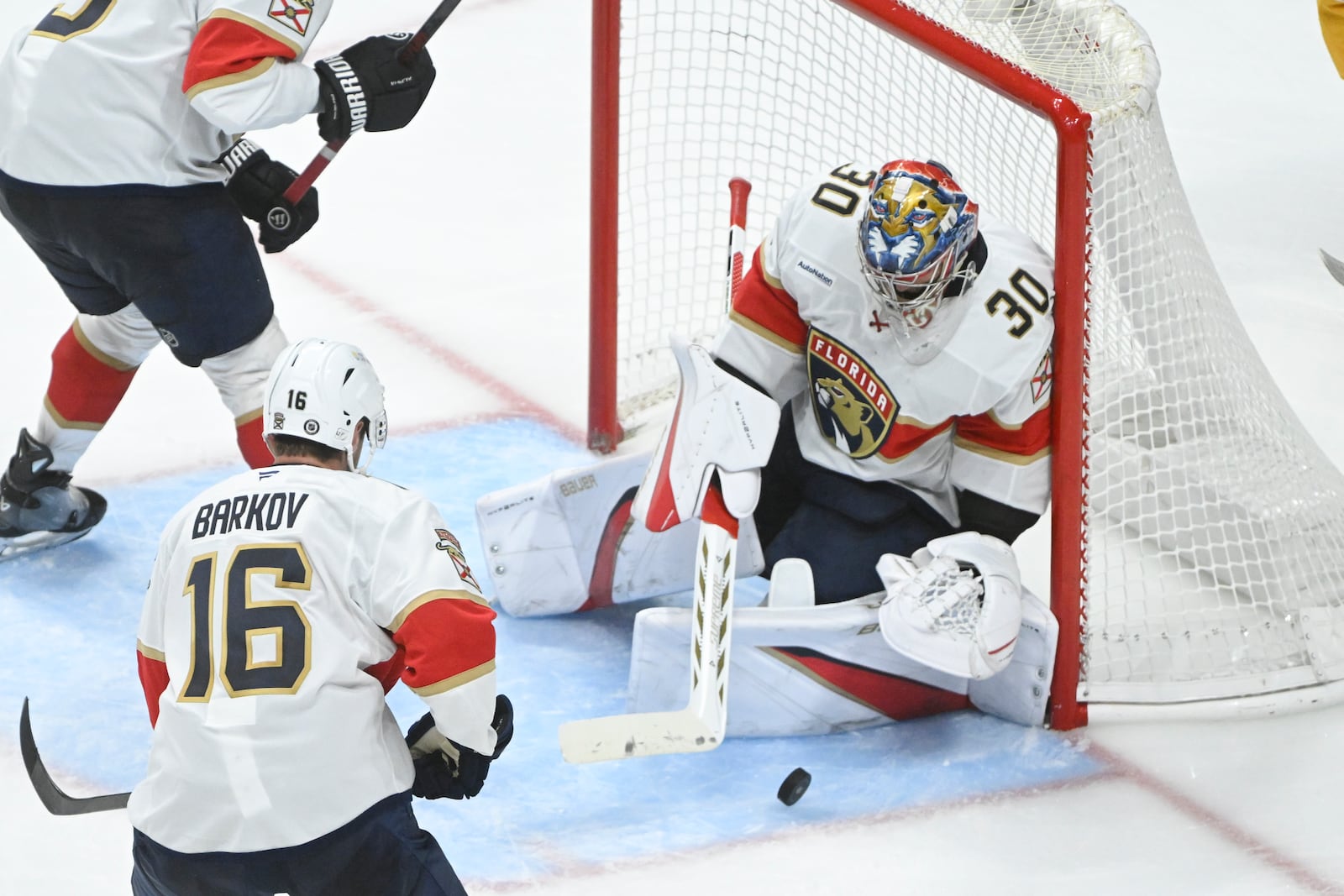 Florida Panthers goaltender Spencer Knight (30) makes a save against the Nashville Predators during the third period of an NHL hockey game Tuesday, Feb. 25, 2025, in Nashville, Tenn. (AP Photo/John Amis)