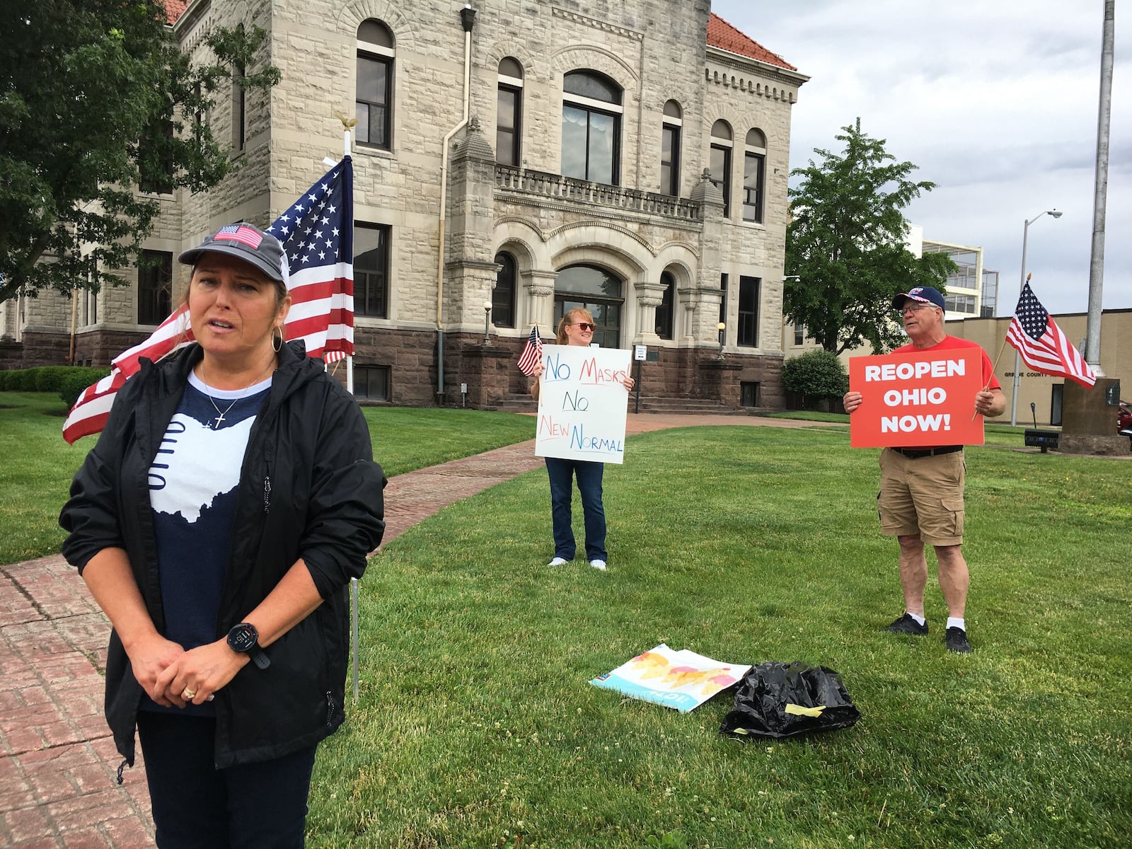 A small group of demonstrators gathered Saturday, June 13, outside the Greene County Courthouse in Xenia to rally for a return to school in the fall without restrictions. This is one of a series of rallies happening across the state. TOM GNAU/STAFF