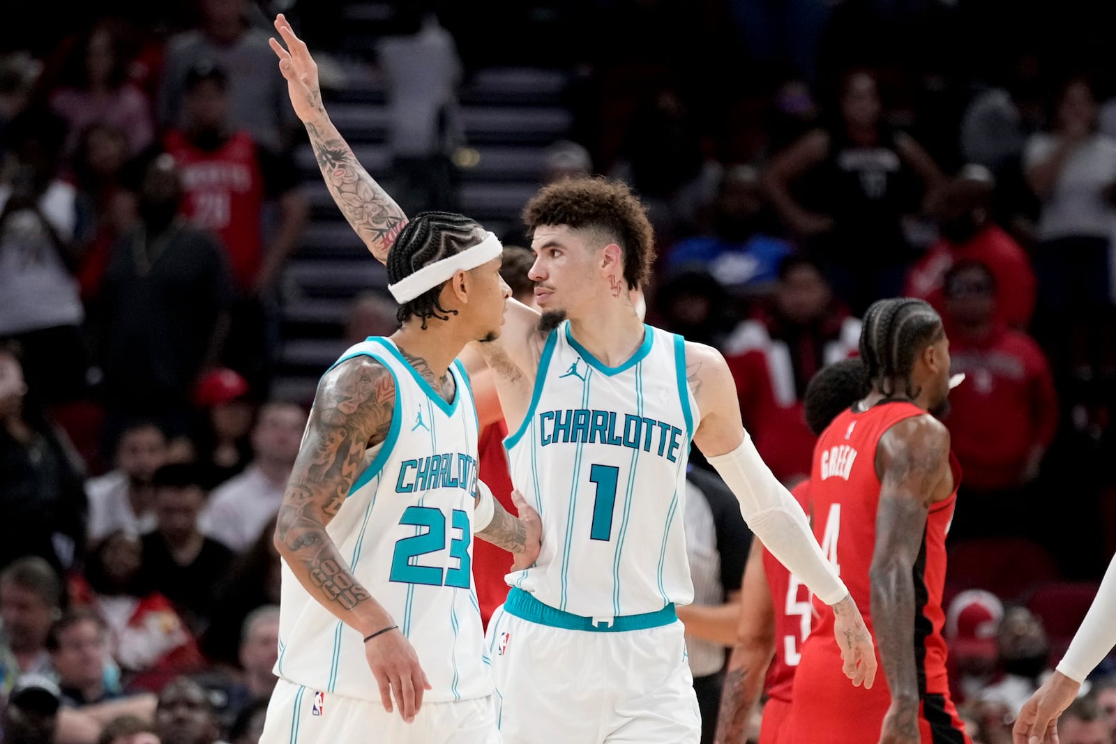 Charlotte Hornets guard LaMelo Ball (1) waves to fans near the end of an NBA basketball game against the Houston Rockets, Wednesday, Oct. 23, 2024, in Houston. (AP Photo/Eric Christian Smith)