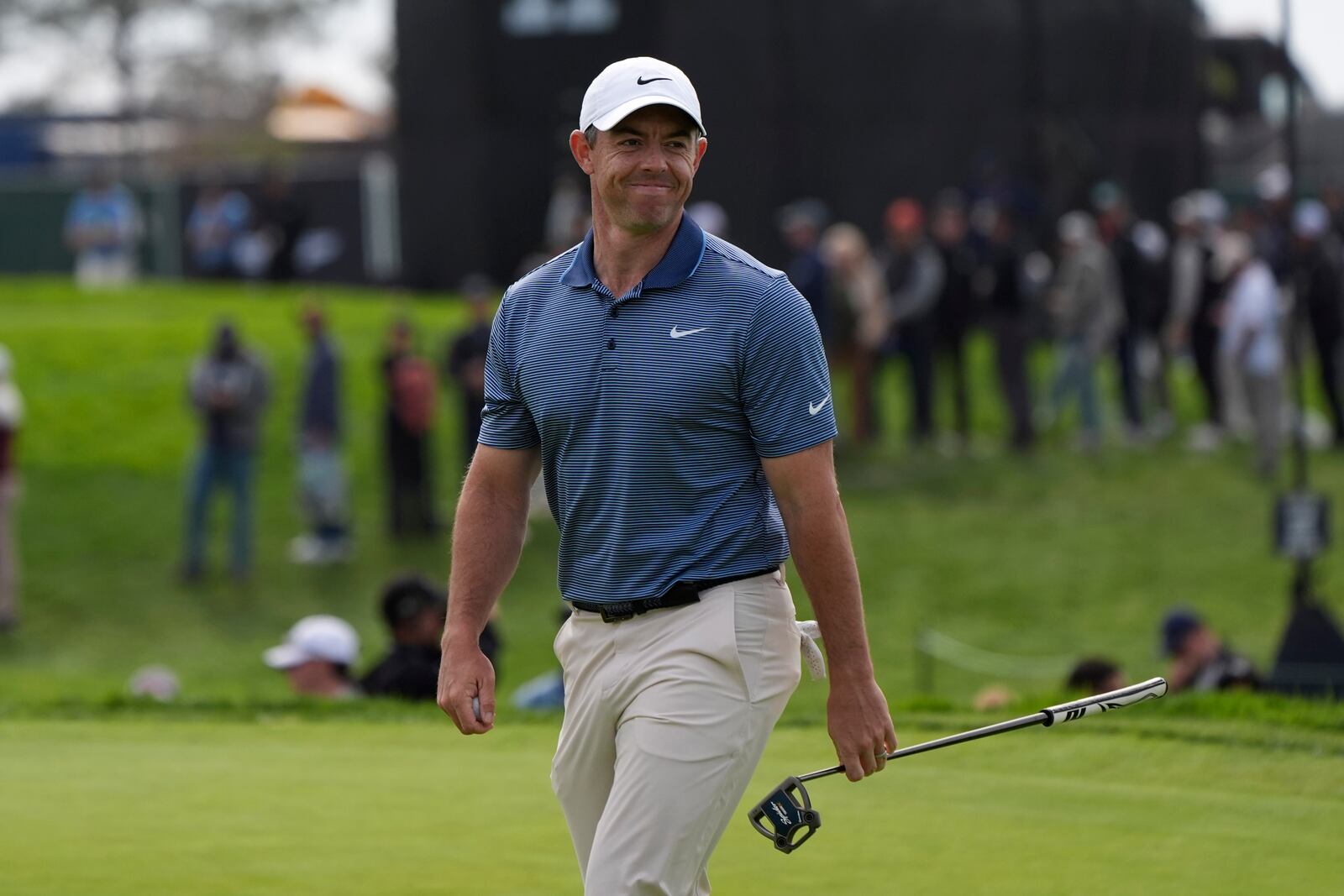 Rory McIlroy, of Northern Ireland, reacts after making a birdie on the 13th hole of the South Course at Torrey Pines during the final round of the Genesis Invitational golf tournament Sunday, Feb. 16, 2025, in San Diego. (AP Photo/Gregory Bull)