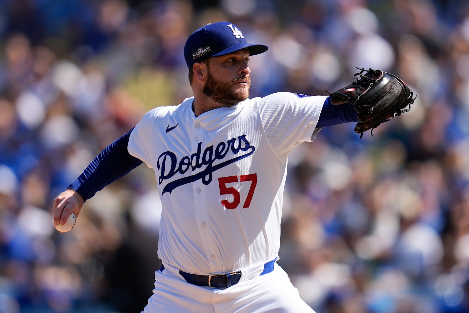 Los Angeles Dodgers pitcher Ryan Brasier throws against the New York Mets during the first inning in Game 2 of a baseball NL Championship Series, Monday, Oct. 14, 2024, in Los Angeles. (AP Photo/Gregory Bull)