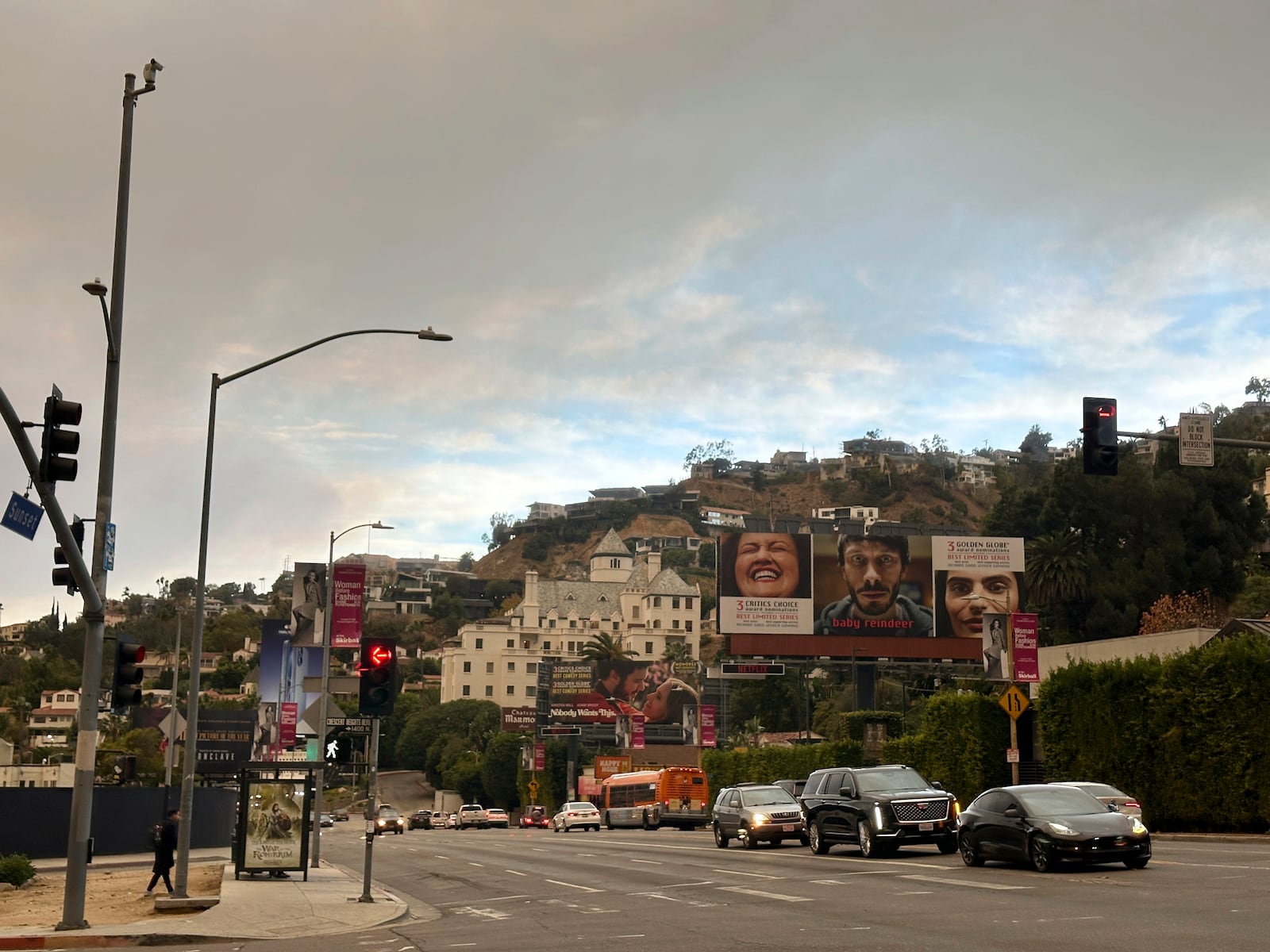 Smoke fills the sky from the Palisades Fire above the Chateau Marmont hotel near the intersection of Sunset Blvd. and Crescent Heights Blvd. Wednesday morning, Jan. 9, 2024, in Los Angeles. (AP Photo/Michael Blood)