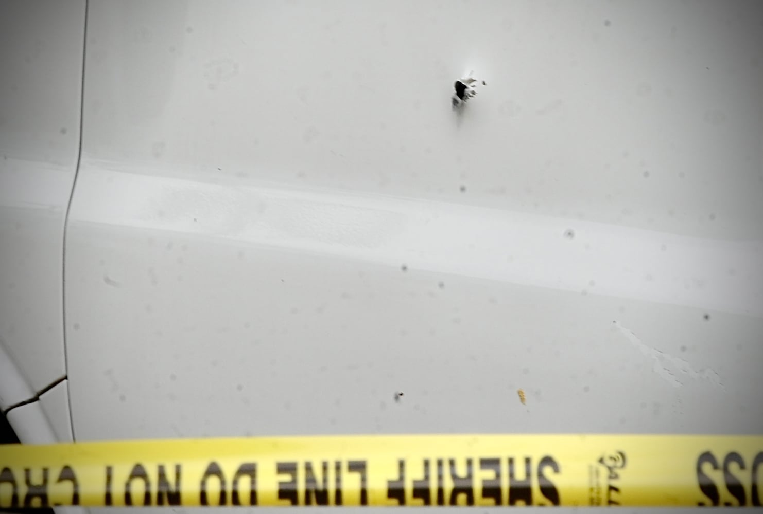 Bullet hole and driver side door of ice cream truck. MARSHALL GORBY \STAFF