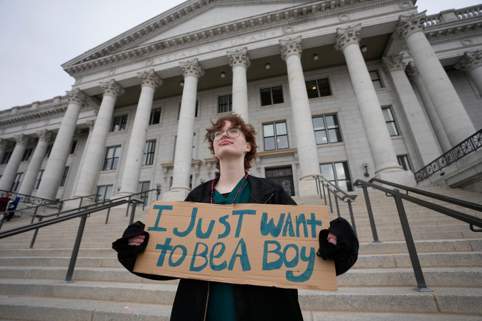 FILE - Tree Crane, 17, stands for a portrait following a rally where hundreds gathered in support of transgender youth at the Utah State Capitol Tuesday, Jan. 24, 2023, in Salt Lake City. (AP Photo/Rick Bowmer, File)