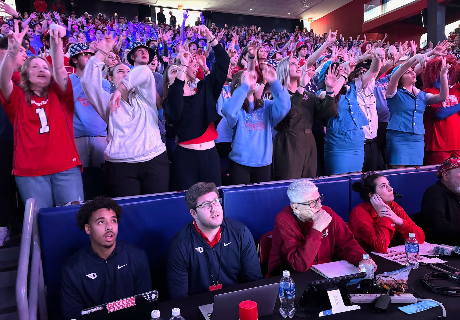 Hal McCoy (bottom, third from left) covers a Dayton game against Loyola Chicago on Jan. 18, 2025, at UD Arena. David Jablonski/Staff