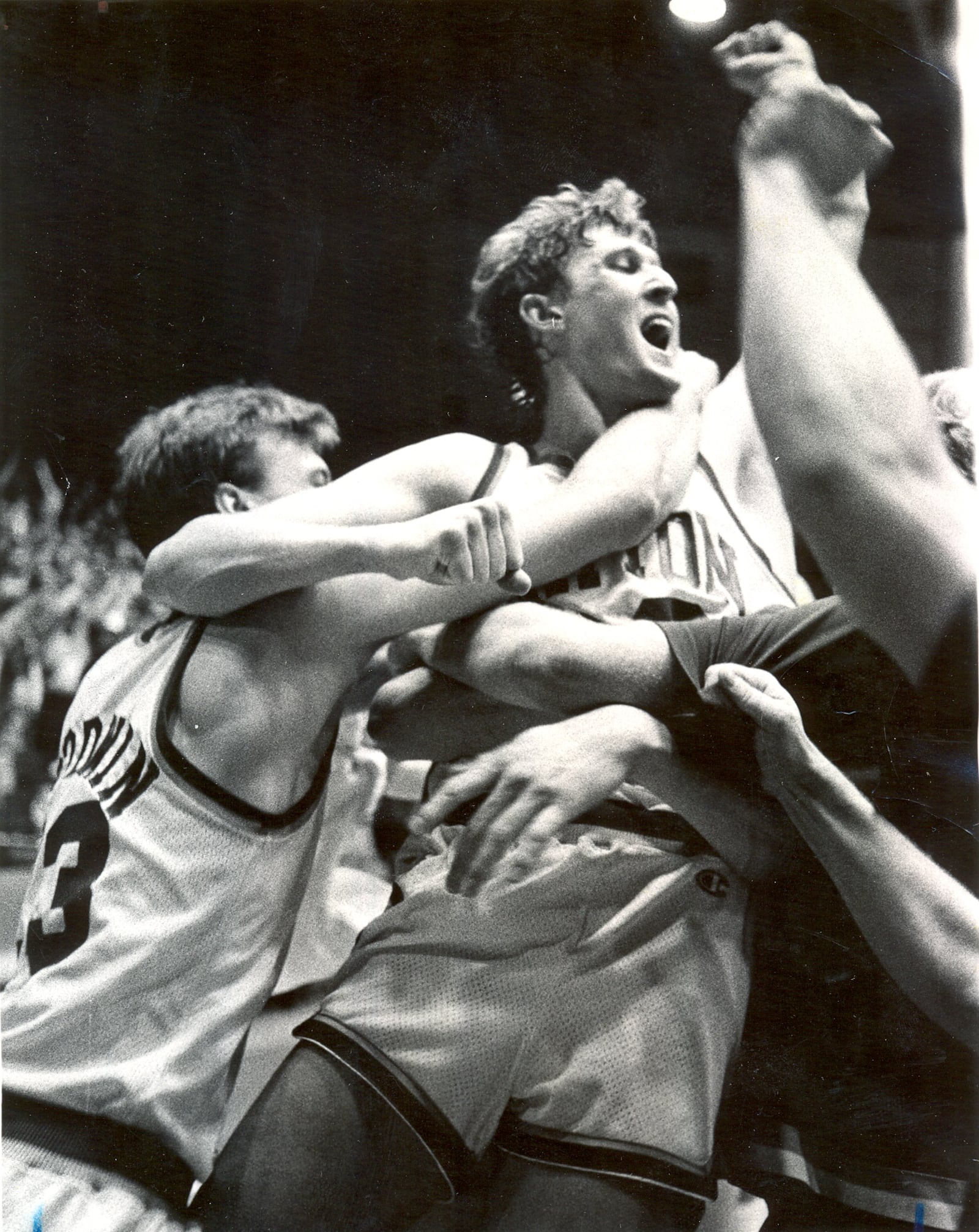 Ed Young is surrounded by his UD teammates after he scored the game-winning basket as the Flyers upset third-ranked DePaul, 72-71, on Feb. 18, 1984.