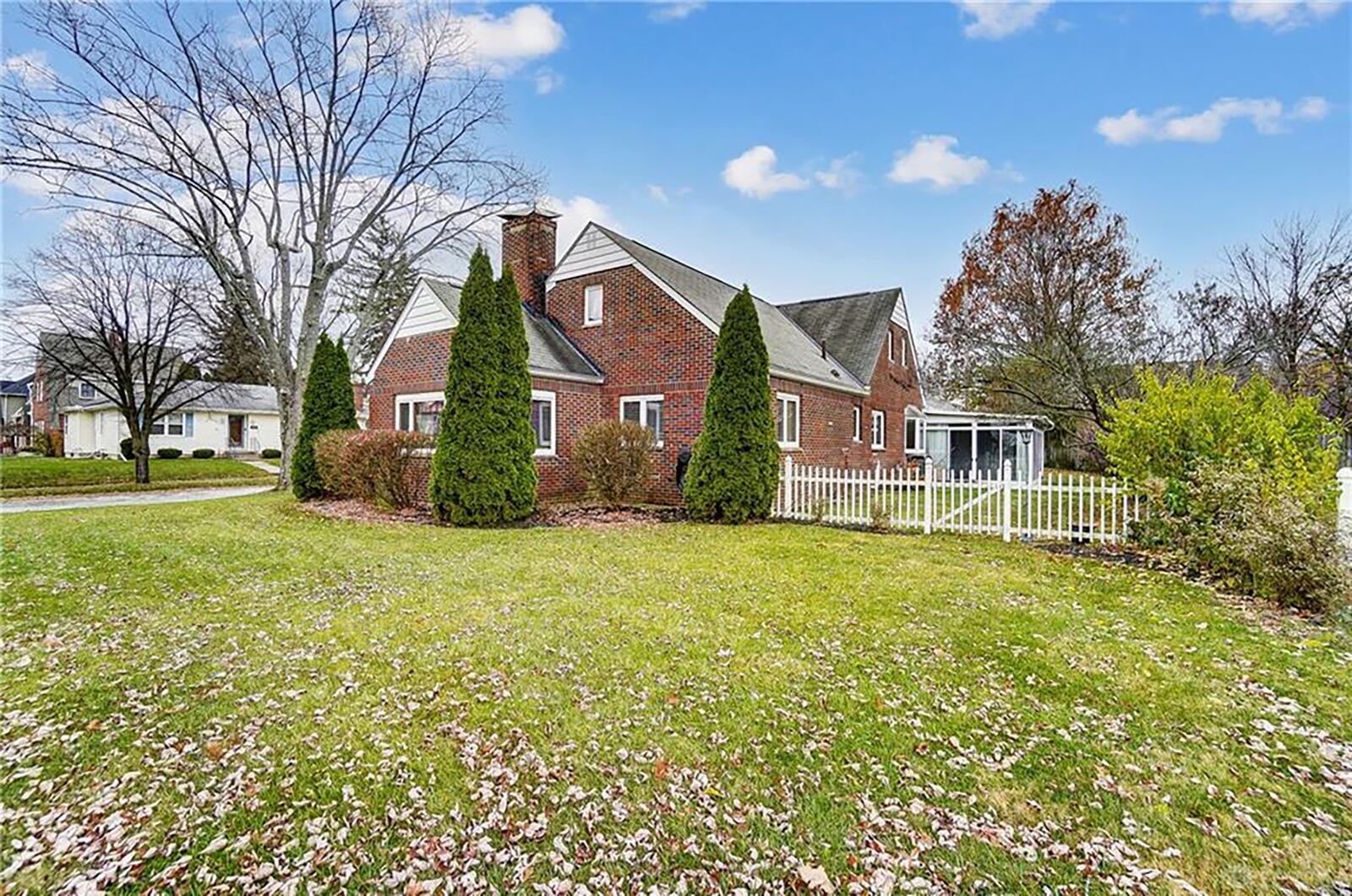 The backyard is fenced with picket and wood privacy. The side yard is not fenced but is part of the property. There is also a Florida room with sliding glass doors on three sides.