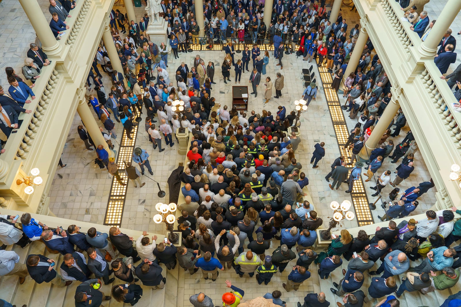 Crowds of people fill the north steps of the Georgia State Capitol to attend a news conference on tort reform hosted by Gov. Brian Kemp, Thursday, Jan. 30, 2025 in Atlanta. (Matthew Pearson/WABE via AP)