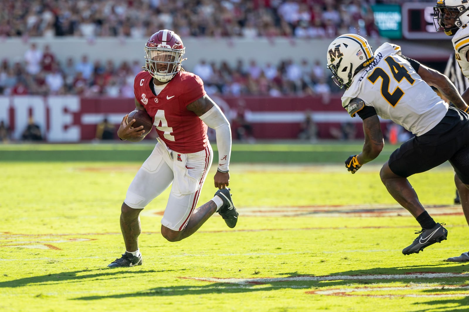 Alabama quarterback Jalen Milroe (4) runs the ball against Missouri during the first half of an NCAA college football game, Saturday, Oct. 26, 2024, in Tuscaloosa, Ala. (AP Photo/Vasha Hunt)