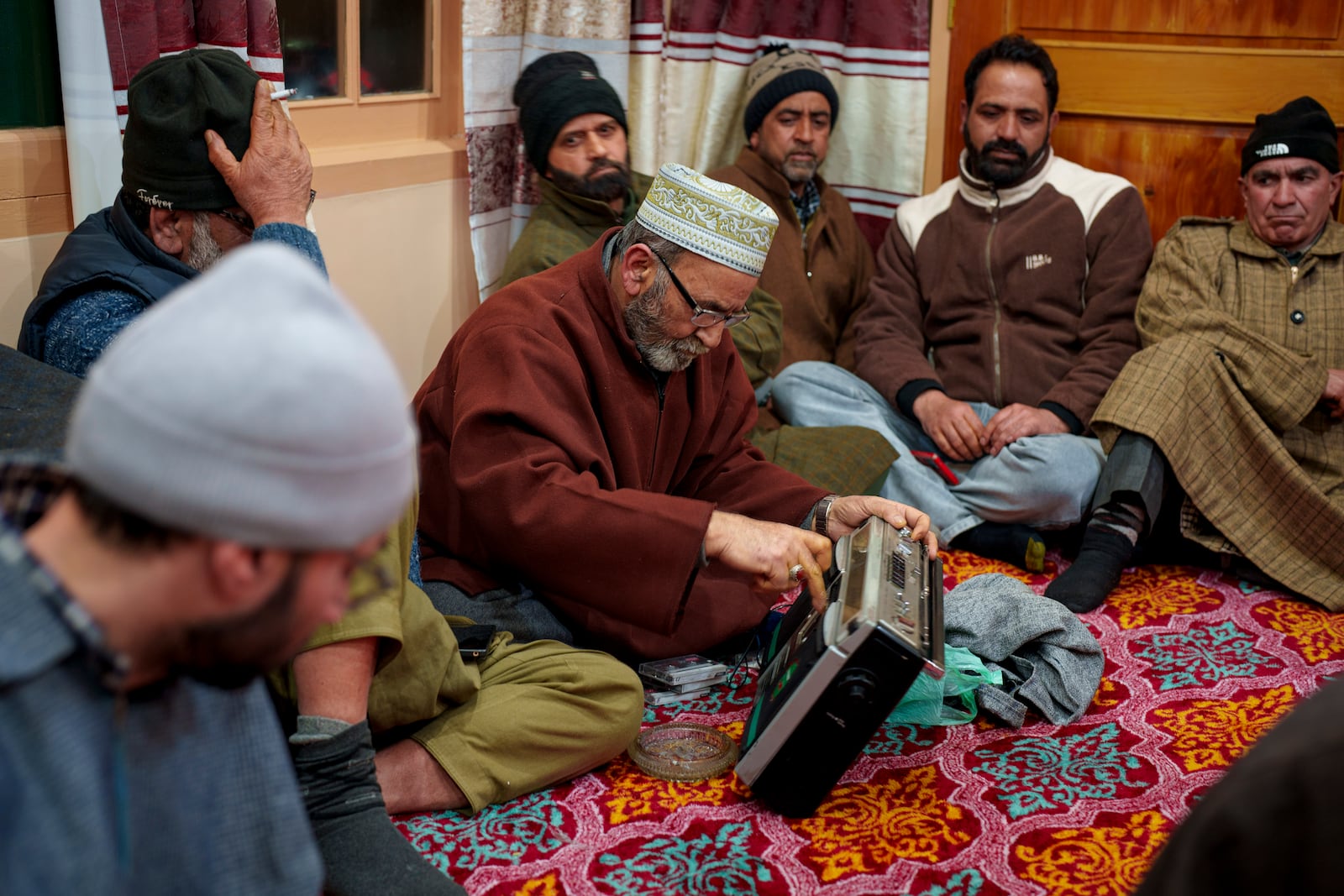 A Kashmiri man checks his tape recorder before the start of the Sufi gathering in the outskirts of Srinagar, Indian controlled Kashmir, Thursday, Feb. 13, 2025. (AP Photo/Dar Yasin)