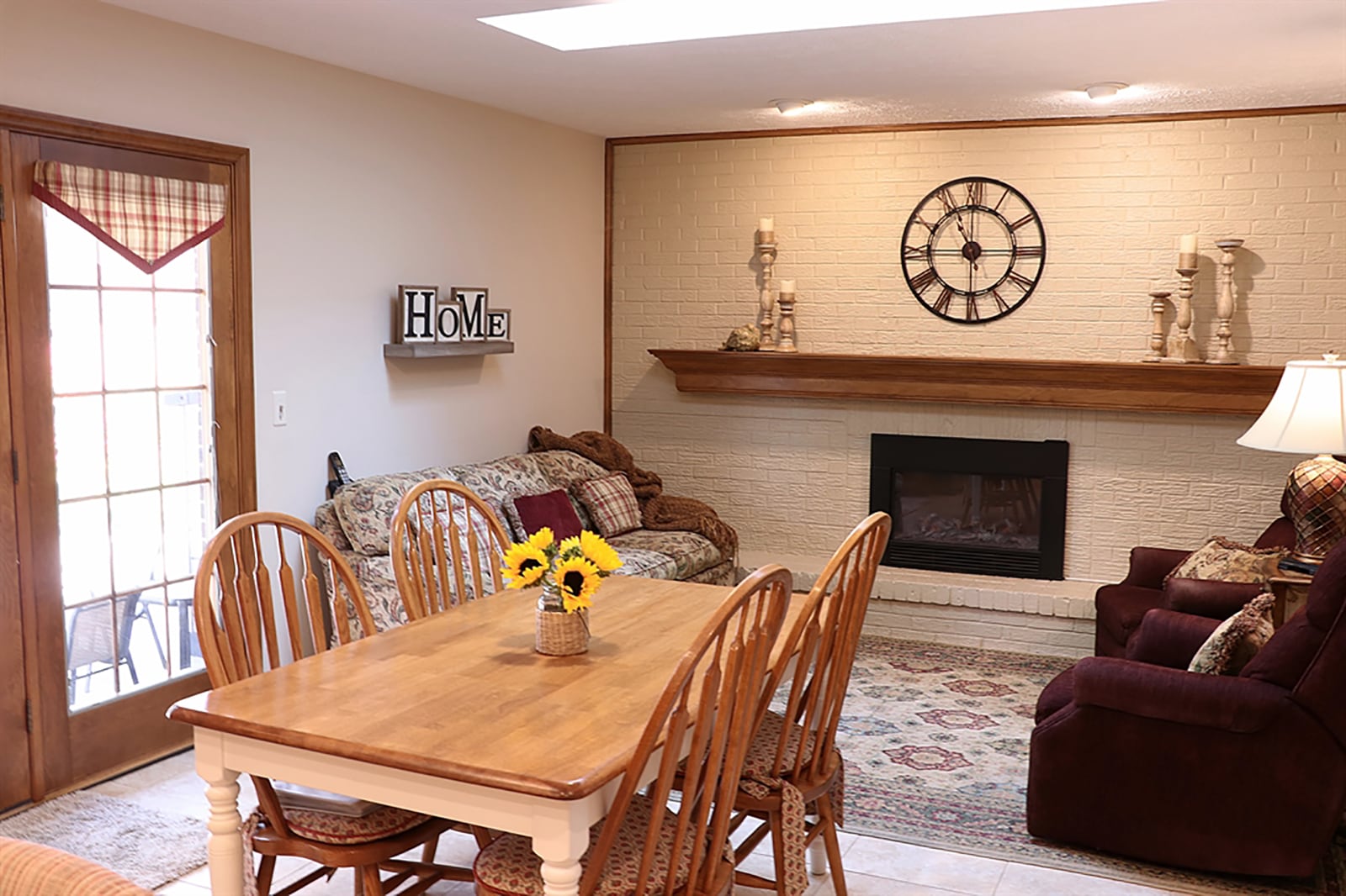 Ceramic-tile flooring fills the kitchen and extends into the breakfast room and hearth room. A painted brick wall surrounds the fireplace, which has a custom wood mantel. CONTRIBUTED PHOTO BY KATHY TYLER