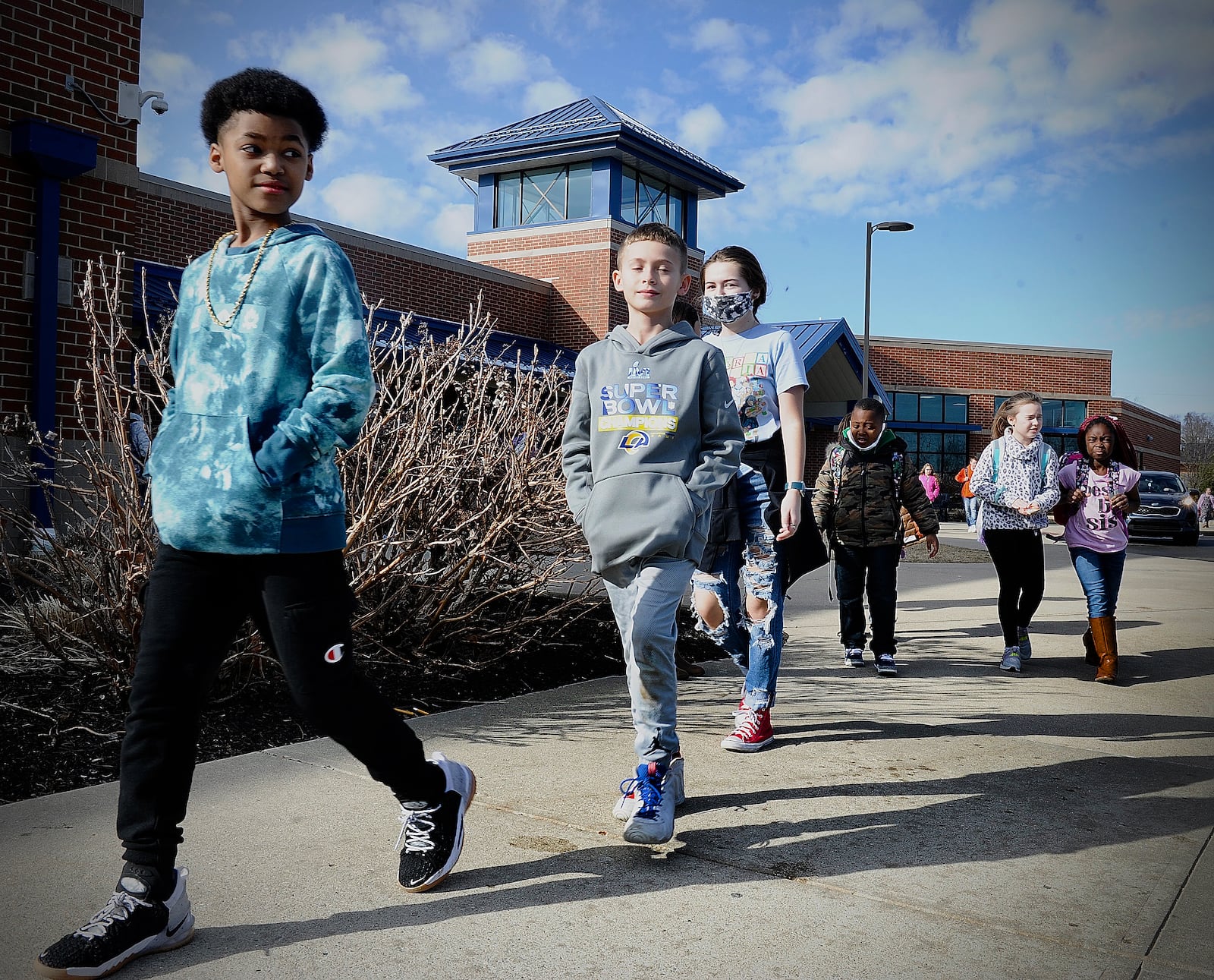 Huber Heights students get on the bus at Valley Forge Elementary School on Thursday. Huber Heights is one of the local districts that saw an increase in its chronic absenteeism rate last school year compared to pre-pandemic levels. Marshall Gorby / Staff