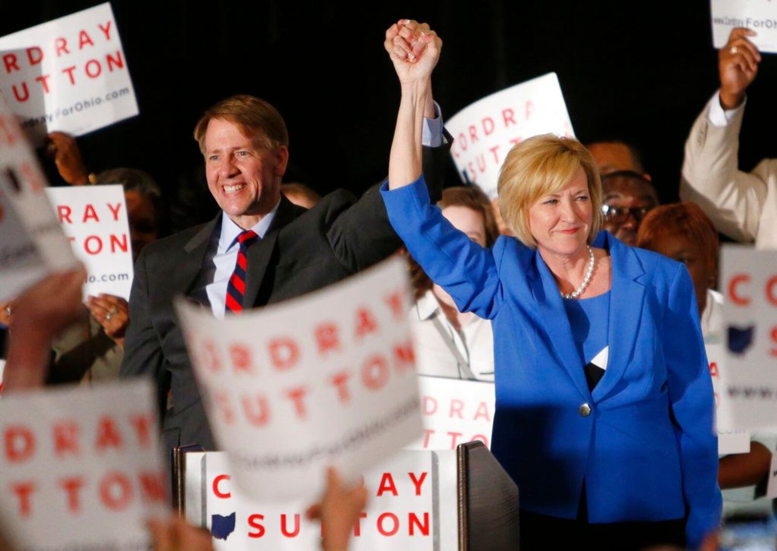 Democratic gubernatorial candidate Richard Cordray, left, and his running mate Betty Sutton greet a crowd of supporters during an election night event.