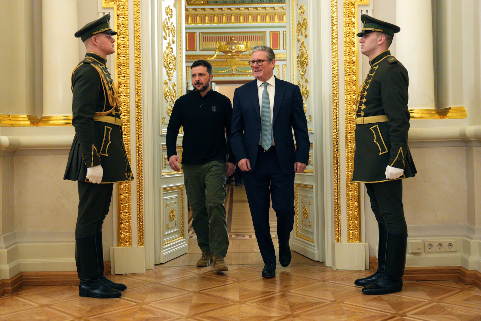 British Prime Minister Keir Starmer, center right and Ukrainian President Volodymyr Zelenskyy arrive for their bilateral talks aat Mariinskyi Palace, in Kyiv, Ukraine Thursday, Jan. 16, 2025. (Carl Court/Pool Photo via AP)