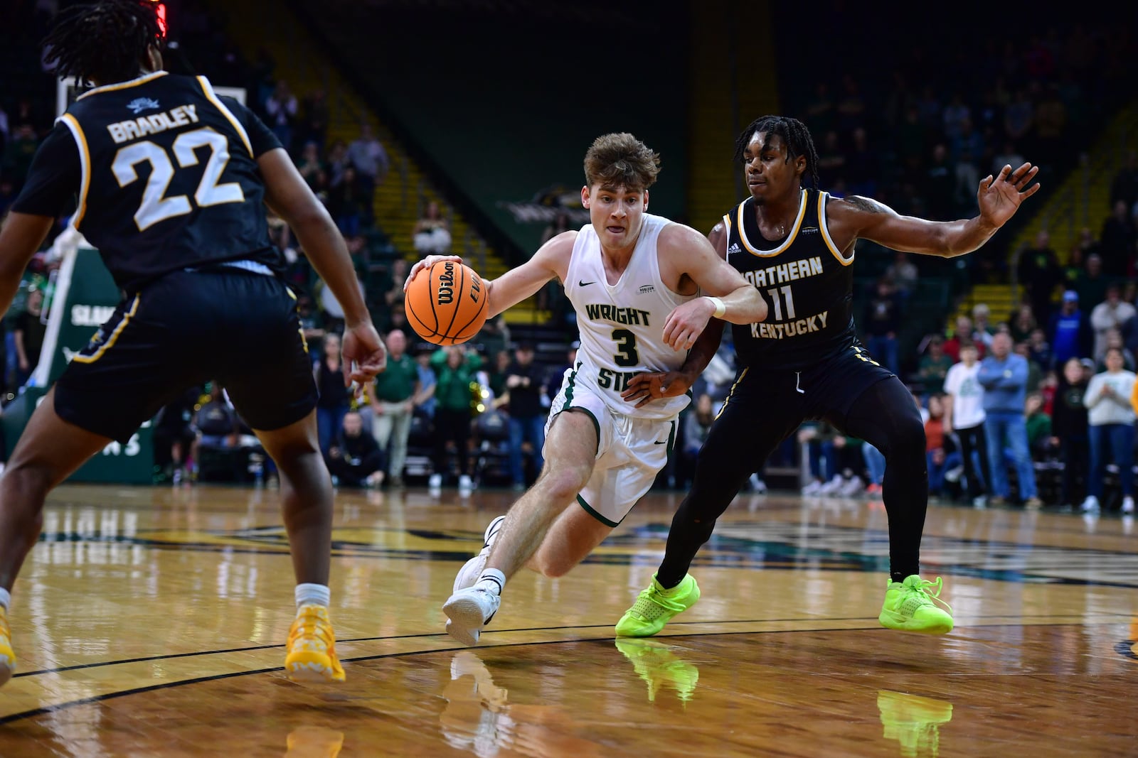 Wright State's Alex Huibregtse drives past Northern Kentucky's Randall Pettus II during a Horizon League quarterfinal at the Nutter Center on March 7, 2024. Joe Craven/Wright State Athletics