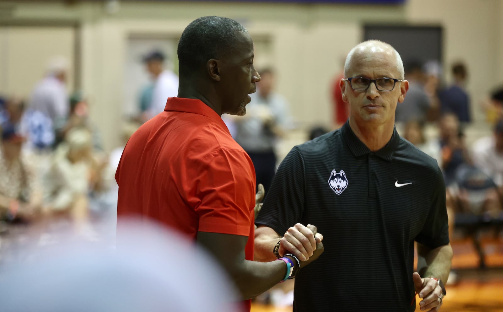 Dayton's Anthony Grant, left, shakes hands with Connecticut's Dan Hurley before their game in the Maui Invitational on Wednesday, Nov. 27, 2024, at the Lahaina Civic Center. David Jablonski/Staff