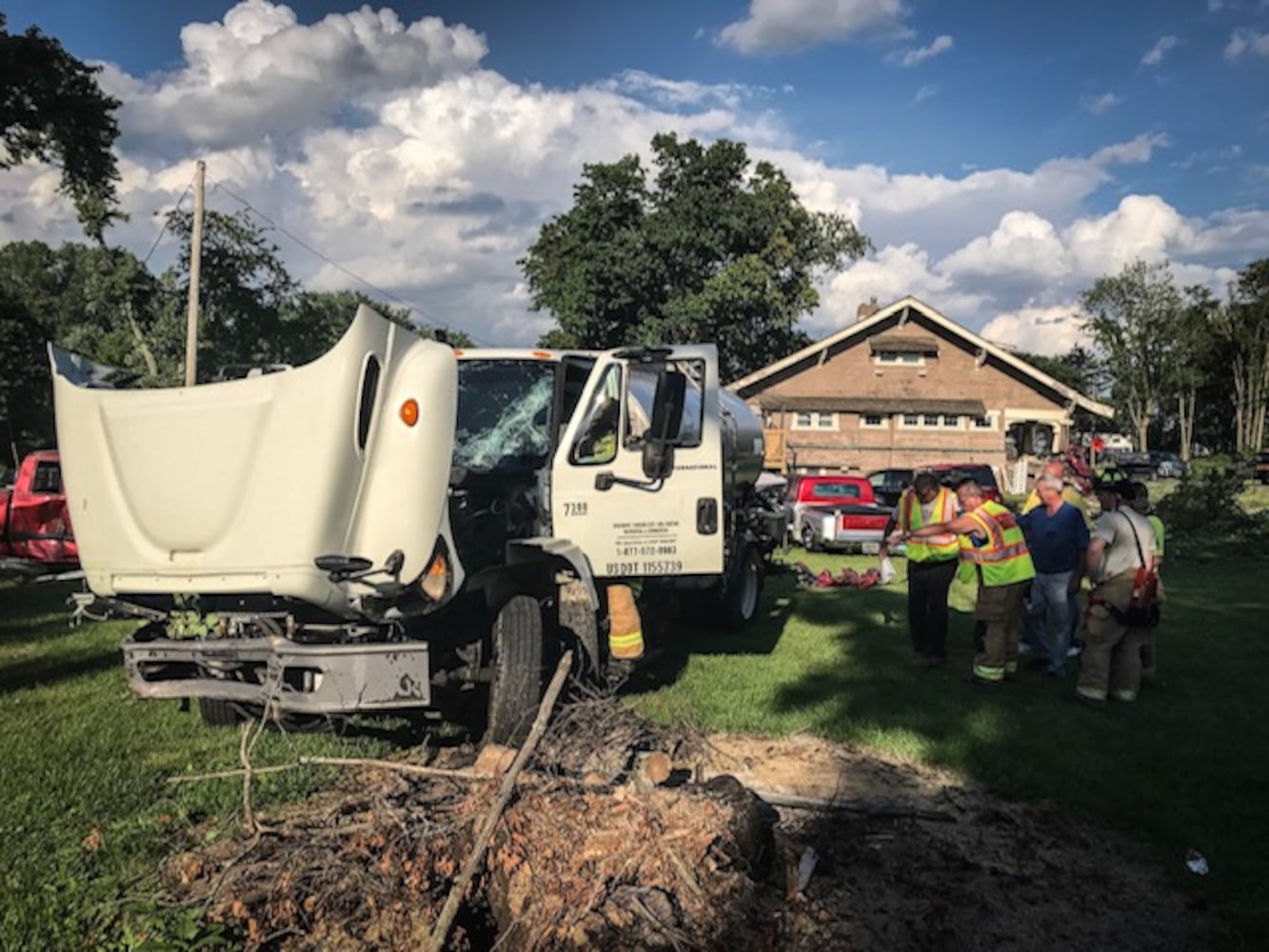 Tanker Truck Strikes Pole, Porch, Cars